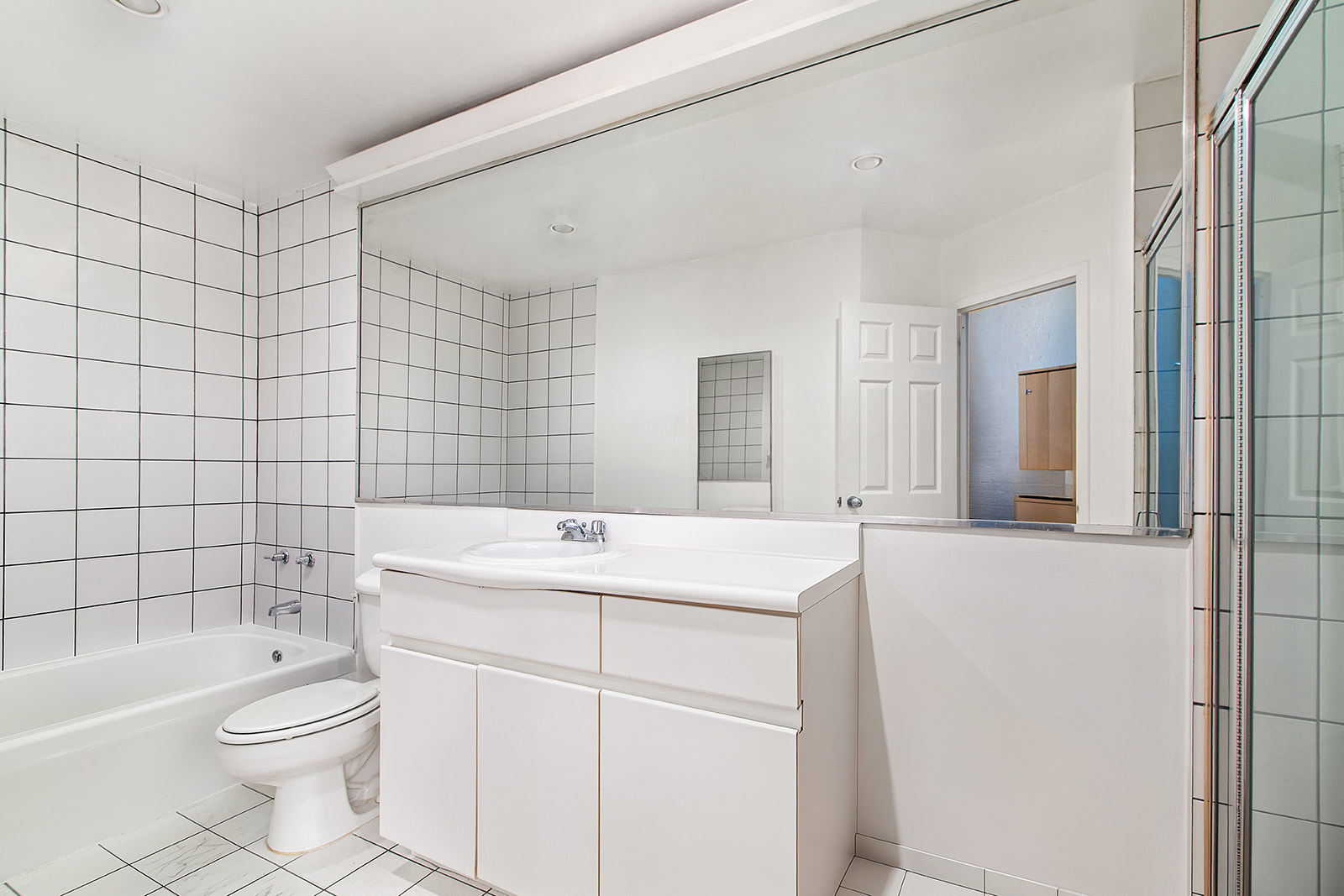 321 West 13th Street, Unit 3A Manhattan, NY 10014 - Photo 10 of 12 a bathroom with a sink a toilet and shower