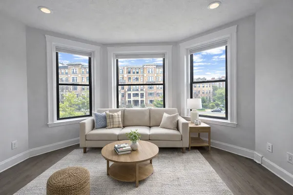 a living room with furniture and a window