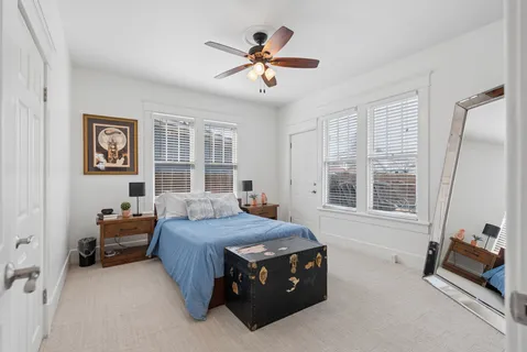 a bedroom with a bed and a dresser