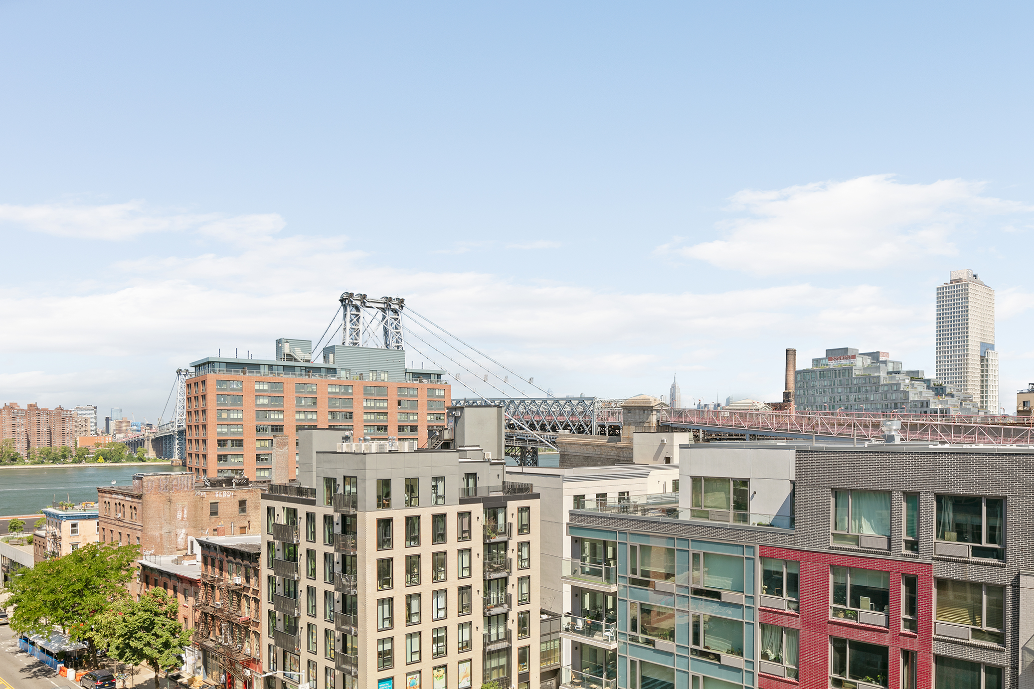 60 Broadway, Unit 6H Brooklyn, NY 11249 - Photo 11 of 16 a view of a city that has tall building