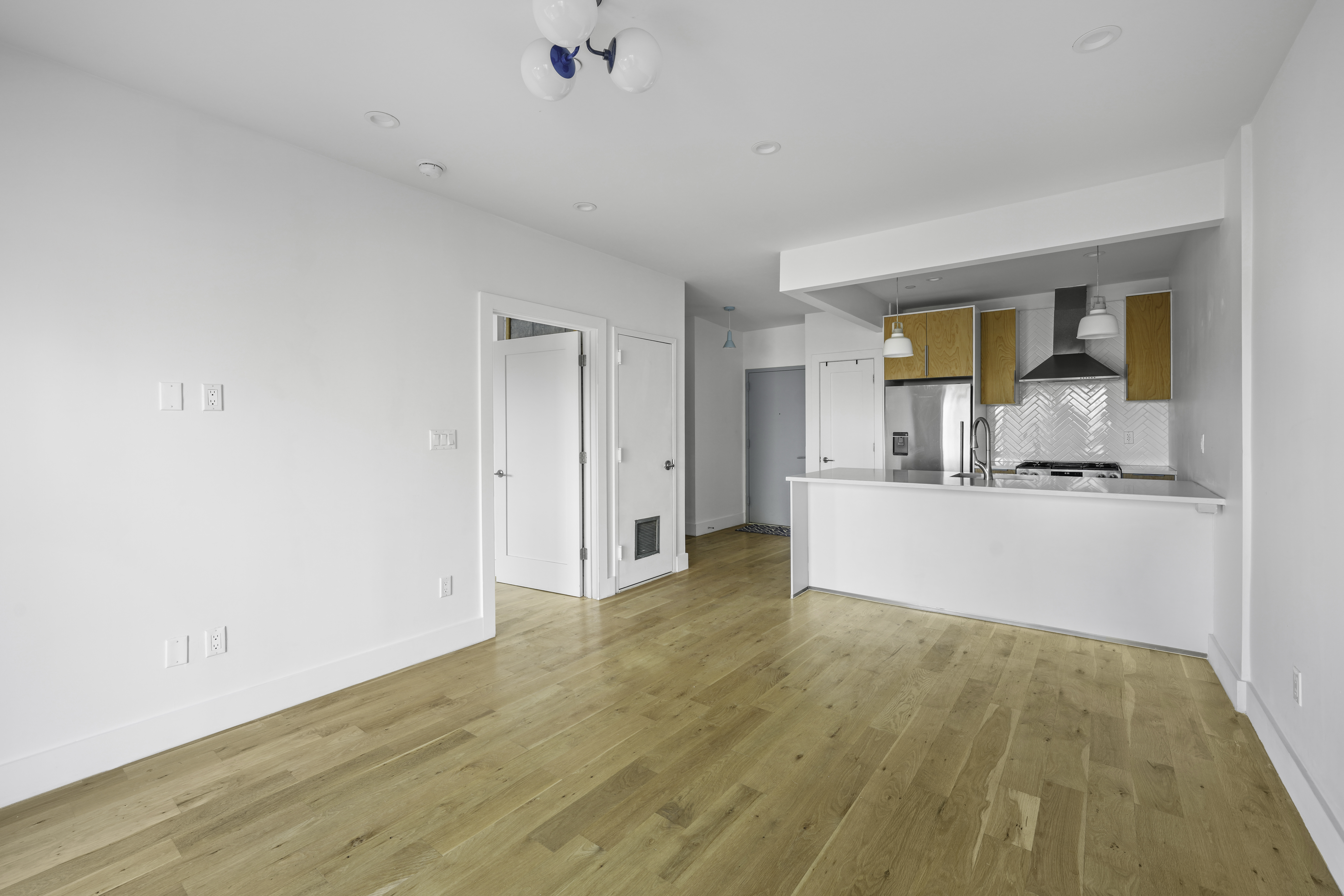 766 Decatur Street, Unit 4A Brooklyn, NY 11233 - Photo 6 of 12 a view of kitchen with wooden floor