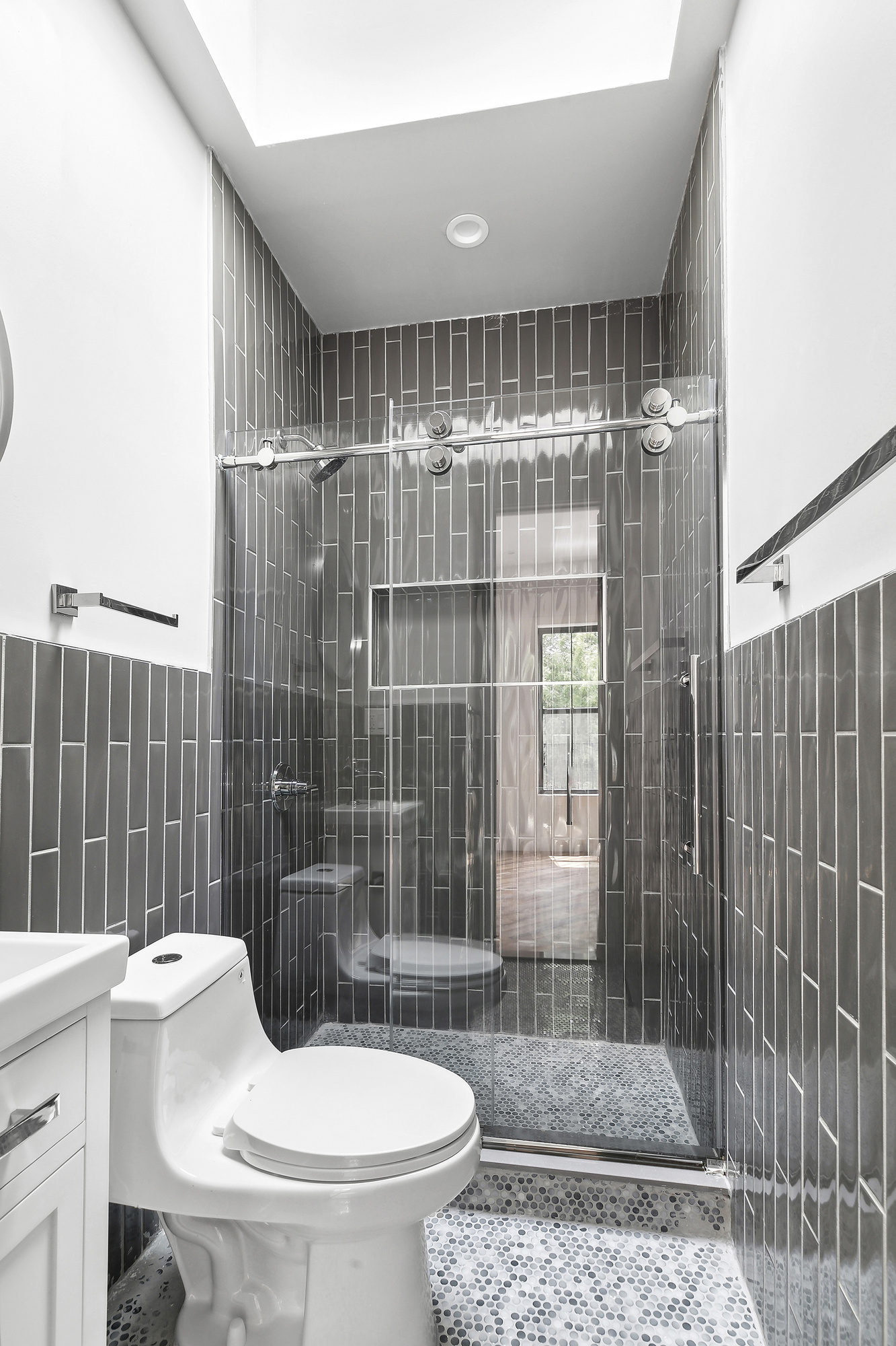 866 Bushwick Avenue, Unit 3 Brooklyn, NY 11221 - Photo 9 of 13 a bathroom with a sink a toilet and shower