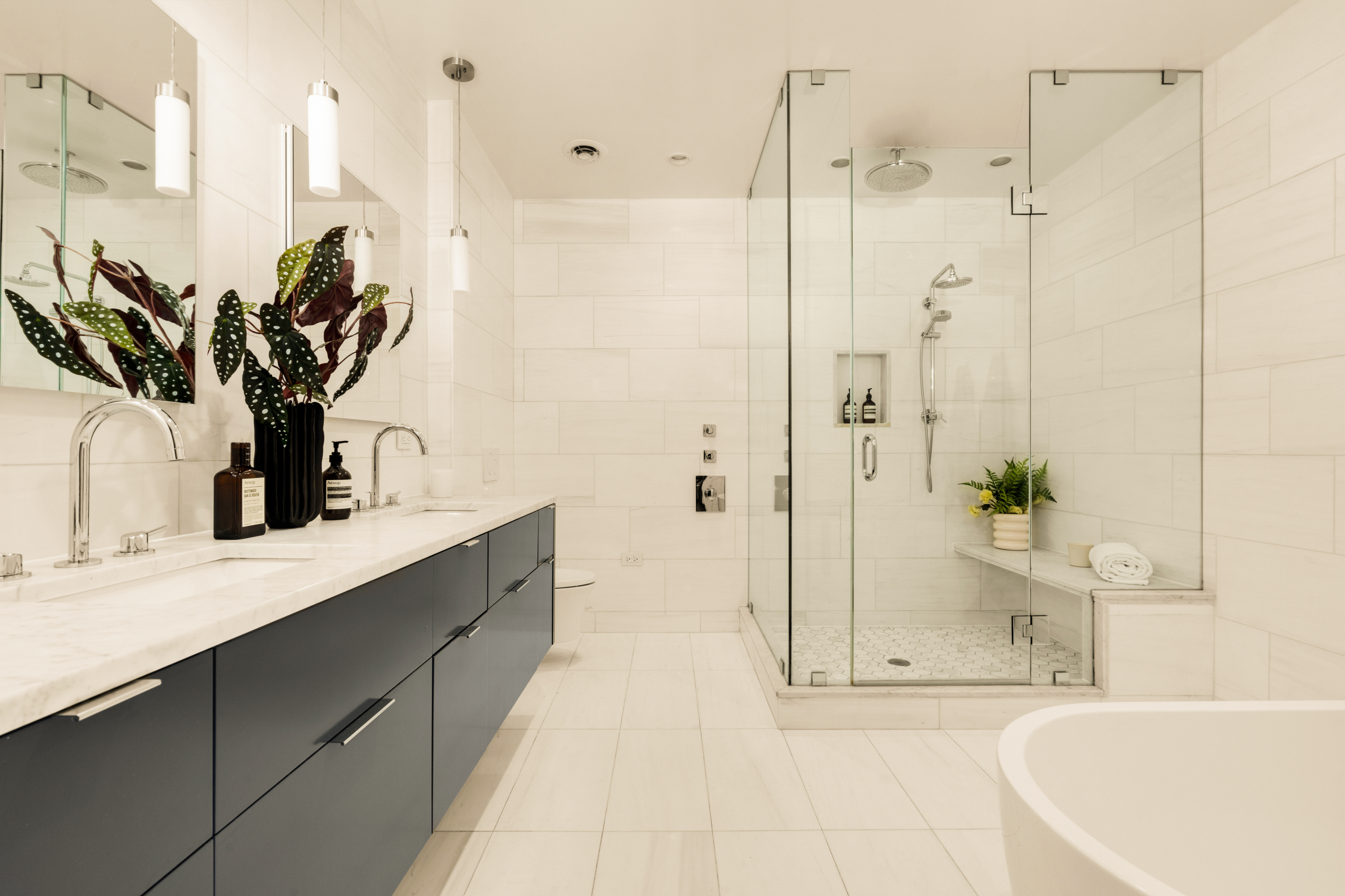 165 Perry Street, Unit 5A Manhattan, NY 10014 - Photo 8 of 14 a bathroom with a tub sink and mirror