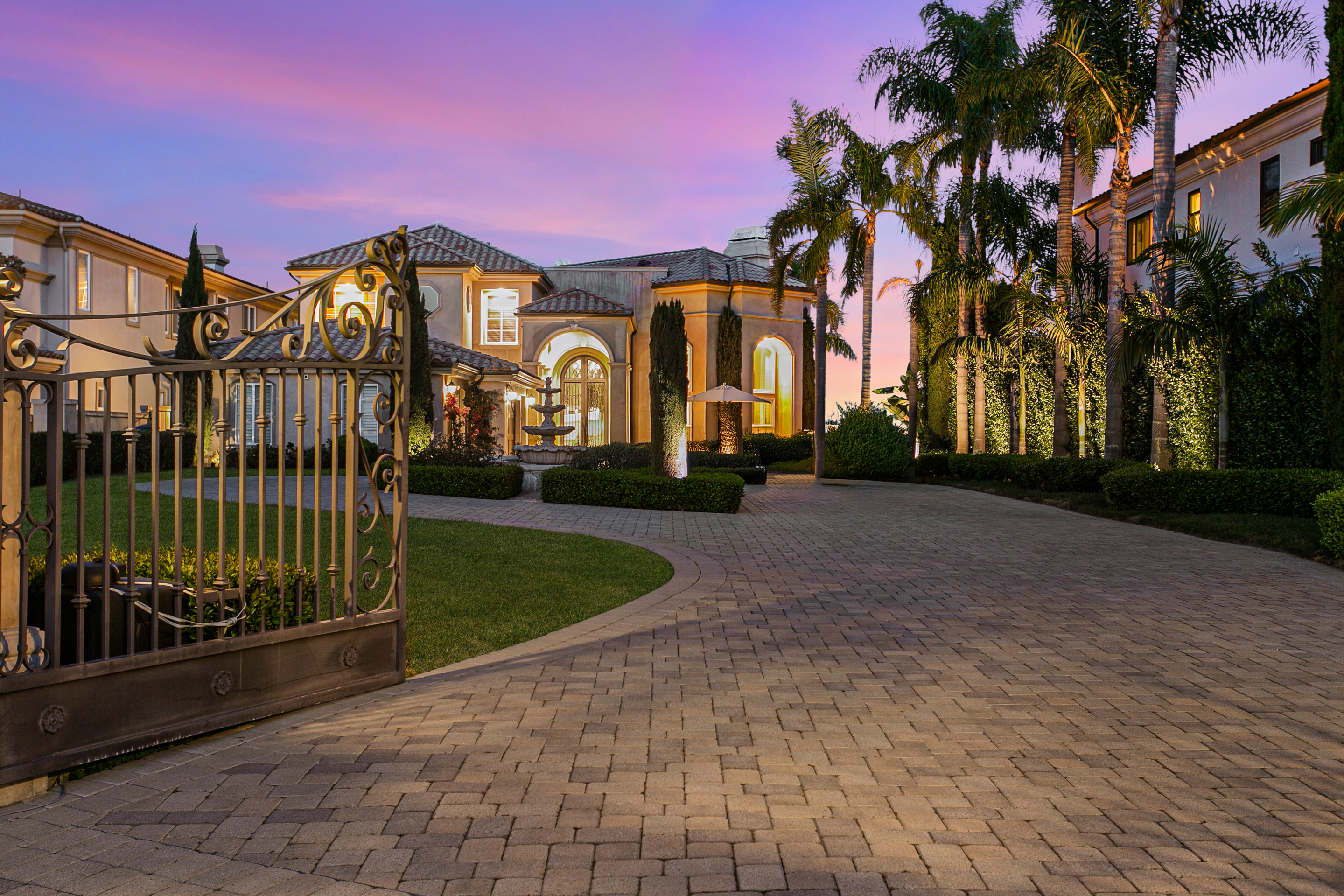 a front view of a building with a garden