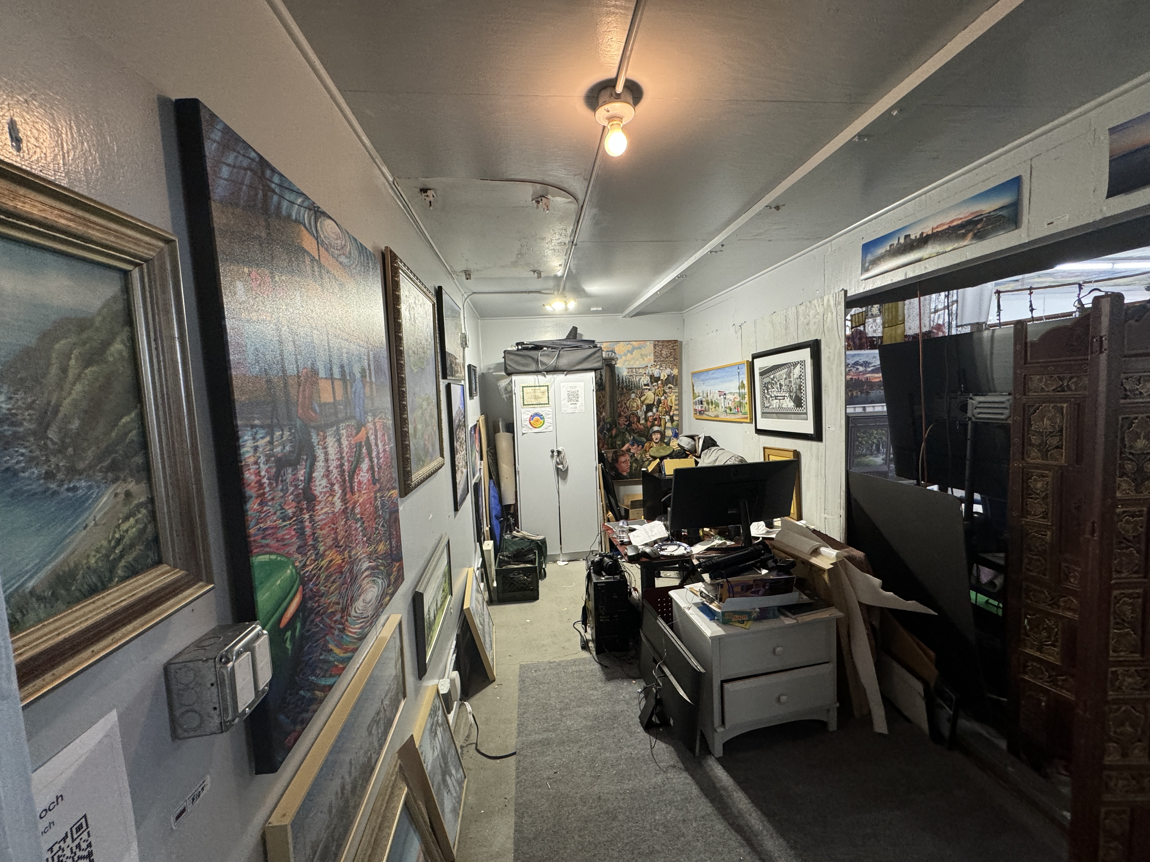 153 Bacon Street San Francisco, CA 94134 - Photo 20 of 26 a living room with furniture and a flat screen tv