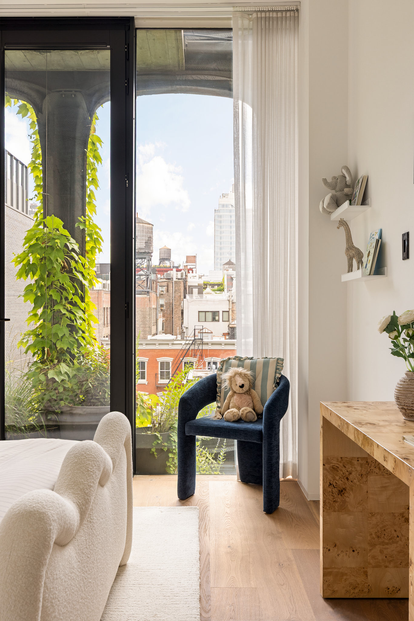 325 West Broadway, Unit 7B Manhattan, NY 10013 - Photo 10 of 21 a living room with furniture and a floor to ceiling window