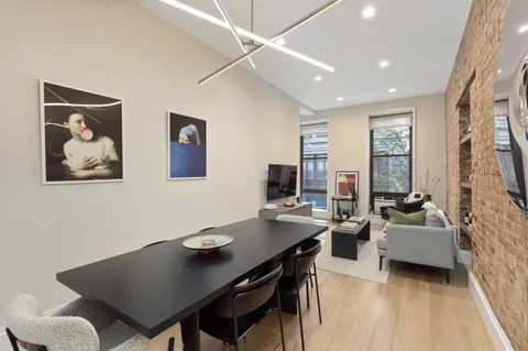 a view of a workspace with furniture and a couch