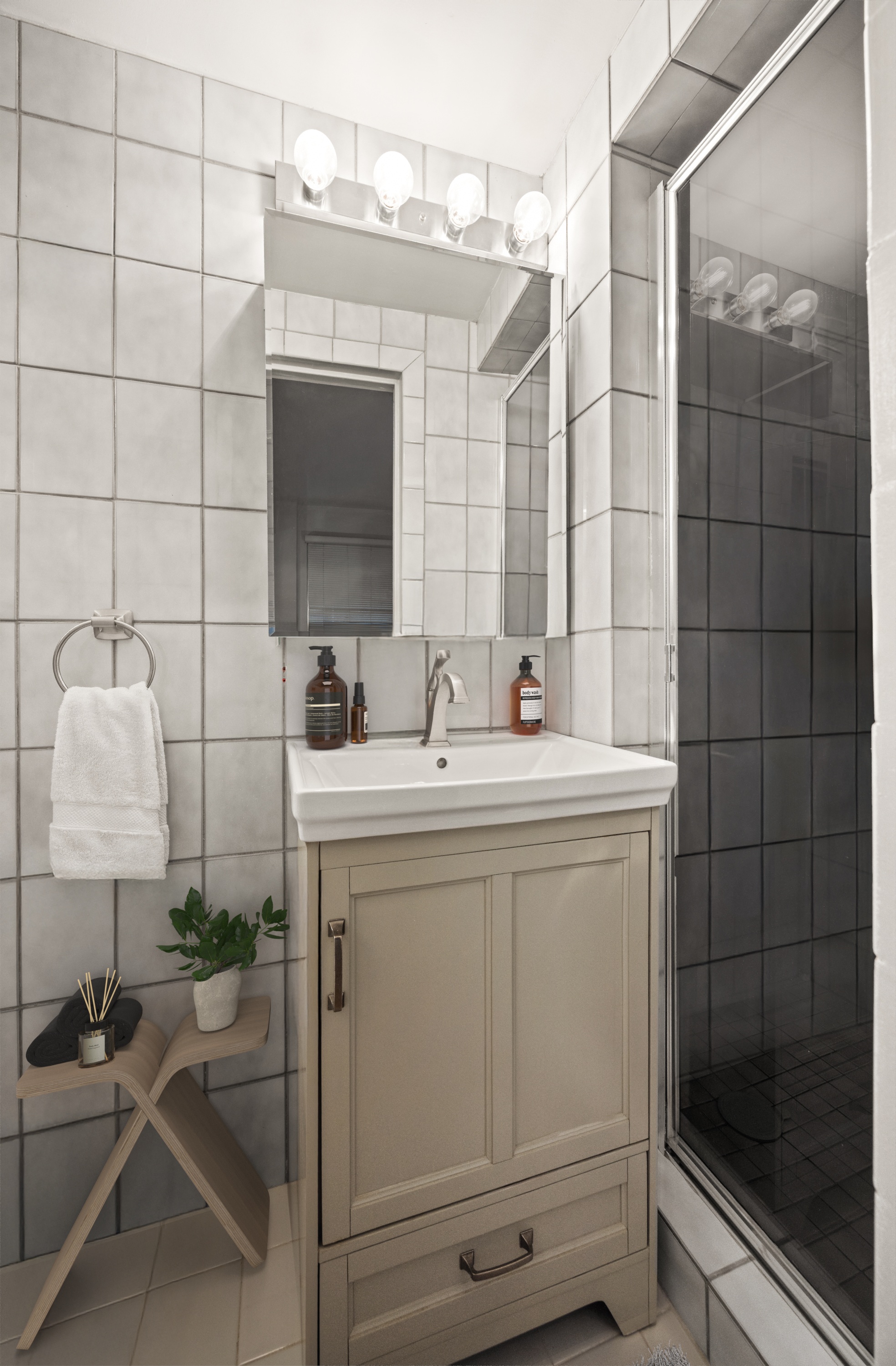 45 West 54th Street, Unit 9E Manhattan, NY 10019 - Photo 7 of 9 a bathroom with a sink toilet and shower