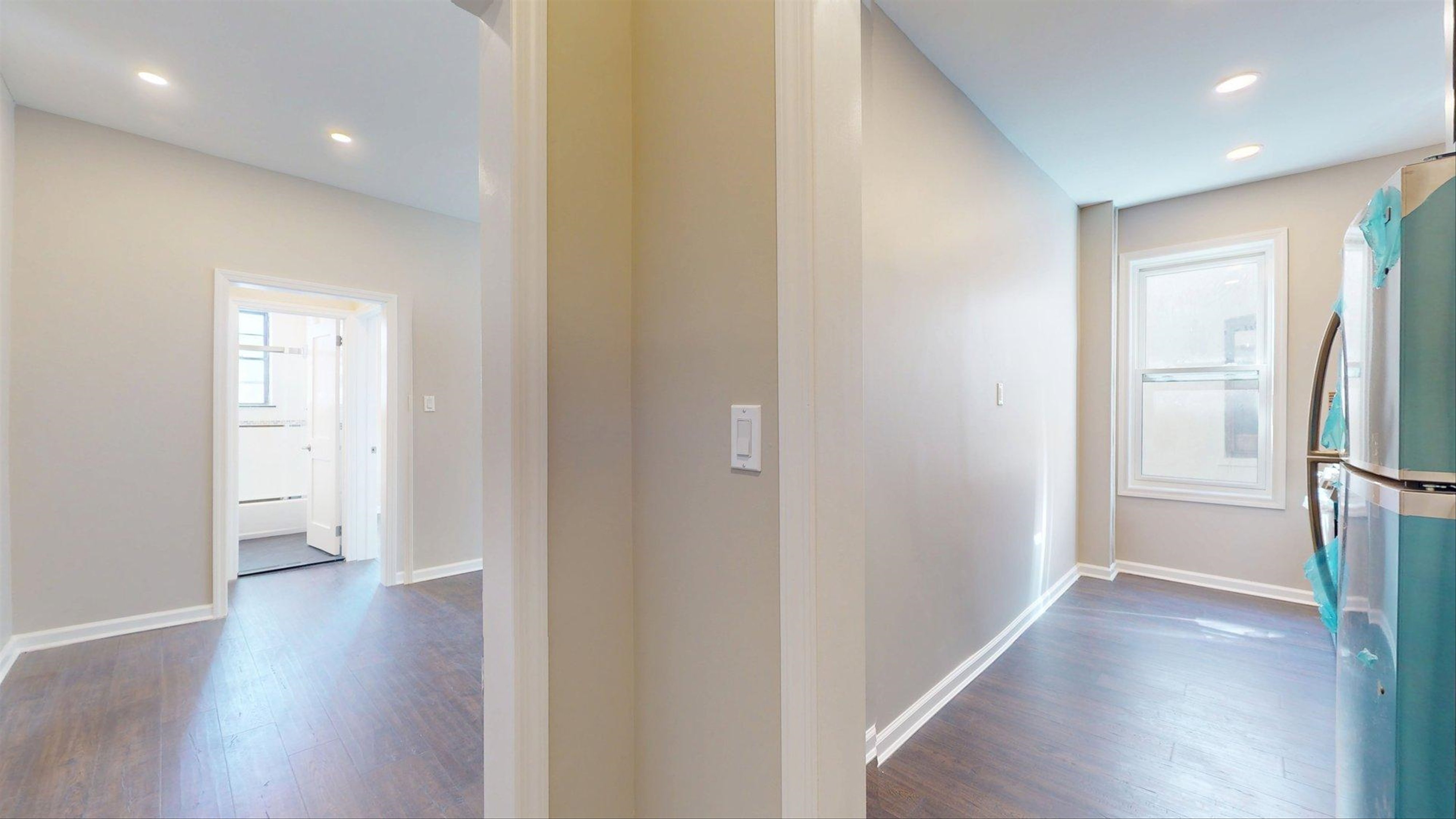 7609 4th Avenue, Unit E14 Brooklyn, NY 11209 - Photo 12 of 15 a view of a hallway with wooden floor