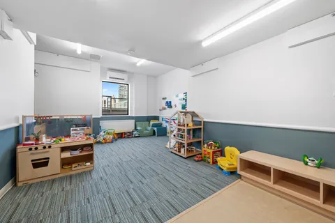 a bedroom with furniture and a wooden floor