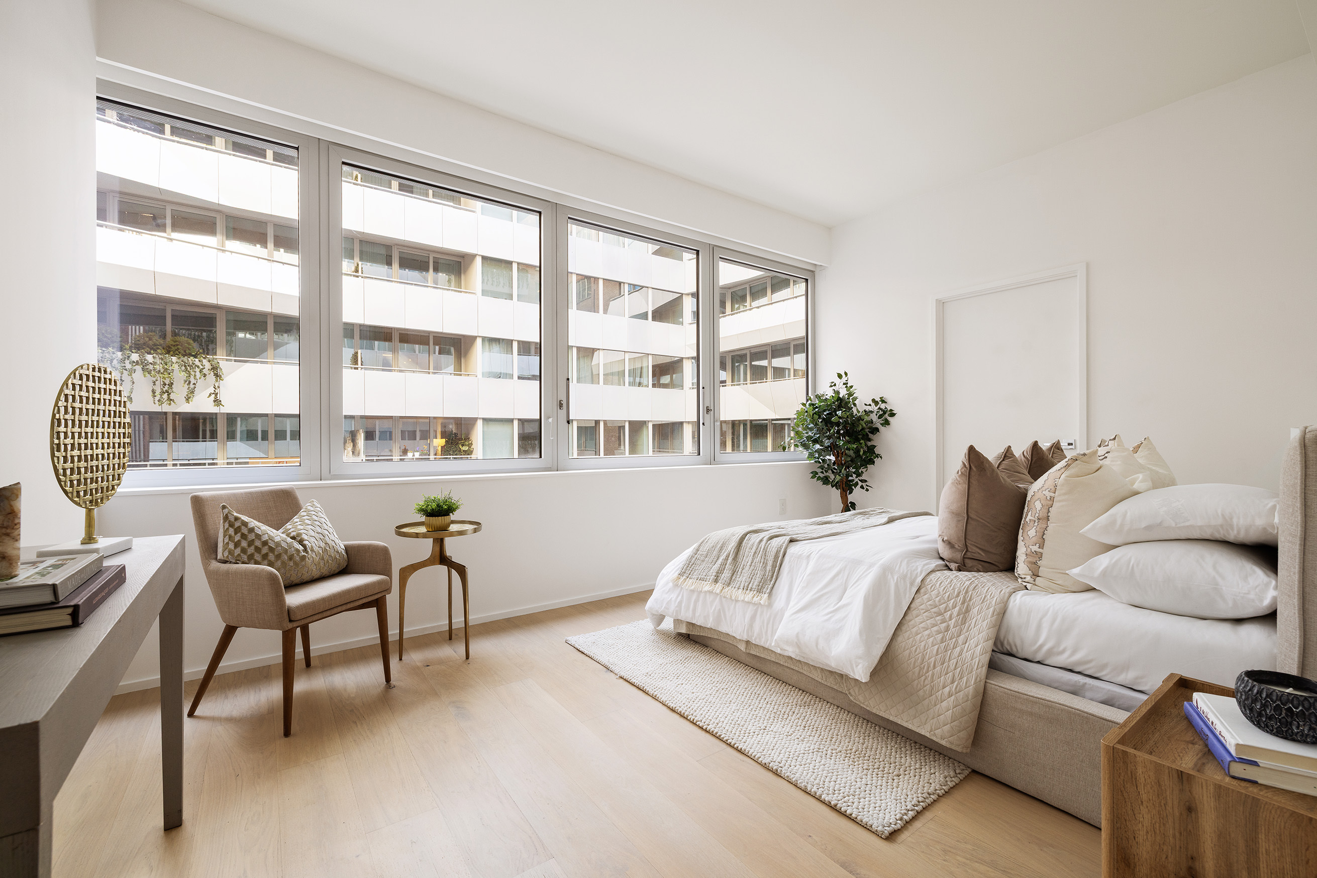 121 East 22nd Street, Unit S603 Manhattan, NY 10010 - Photo 8 of 12 a living room with furniture and a window
