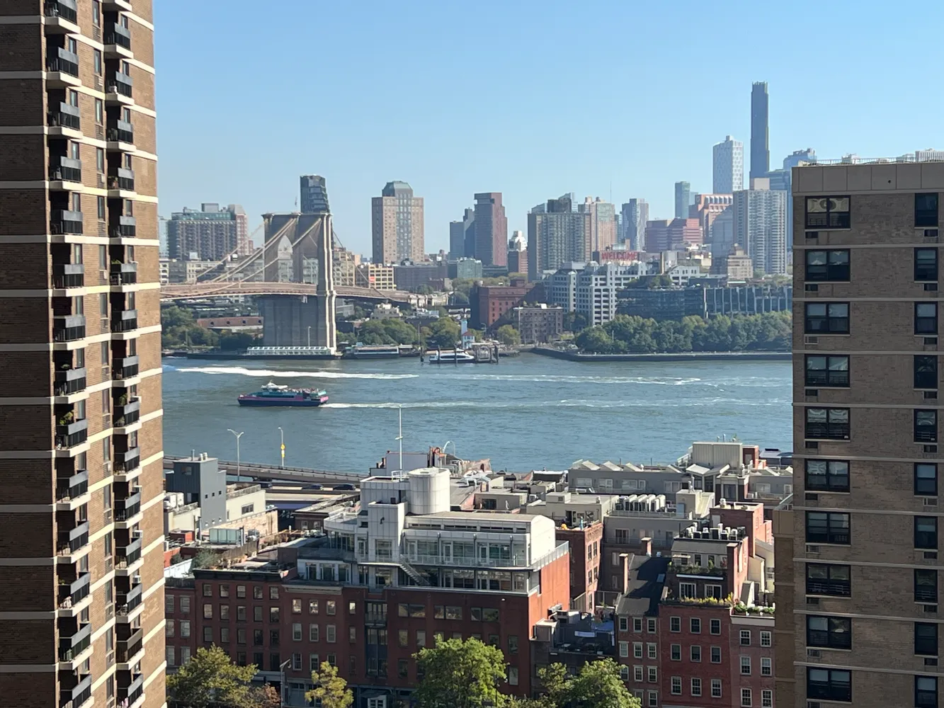 a city view with tall buildings and a lake view