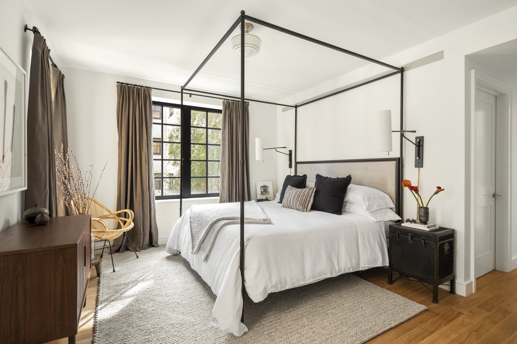 245 East 78th Street, Unit 5A Manhattan, NY 10075 - Photo 5 of 14 a bedroom with a bed next to a window with the outer view