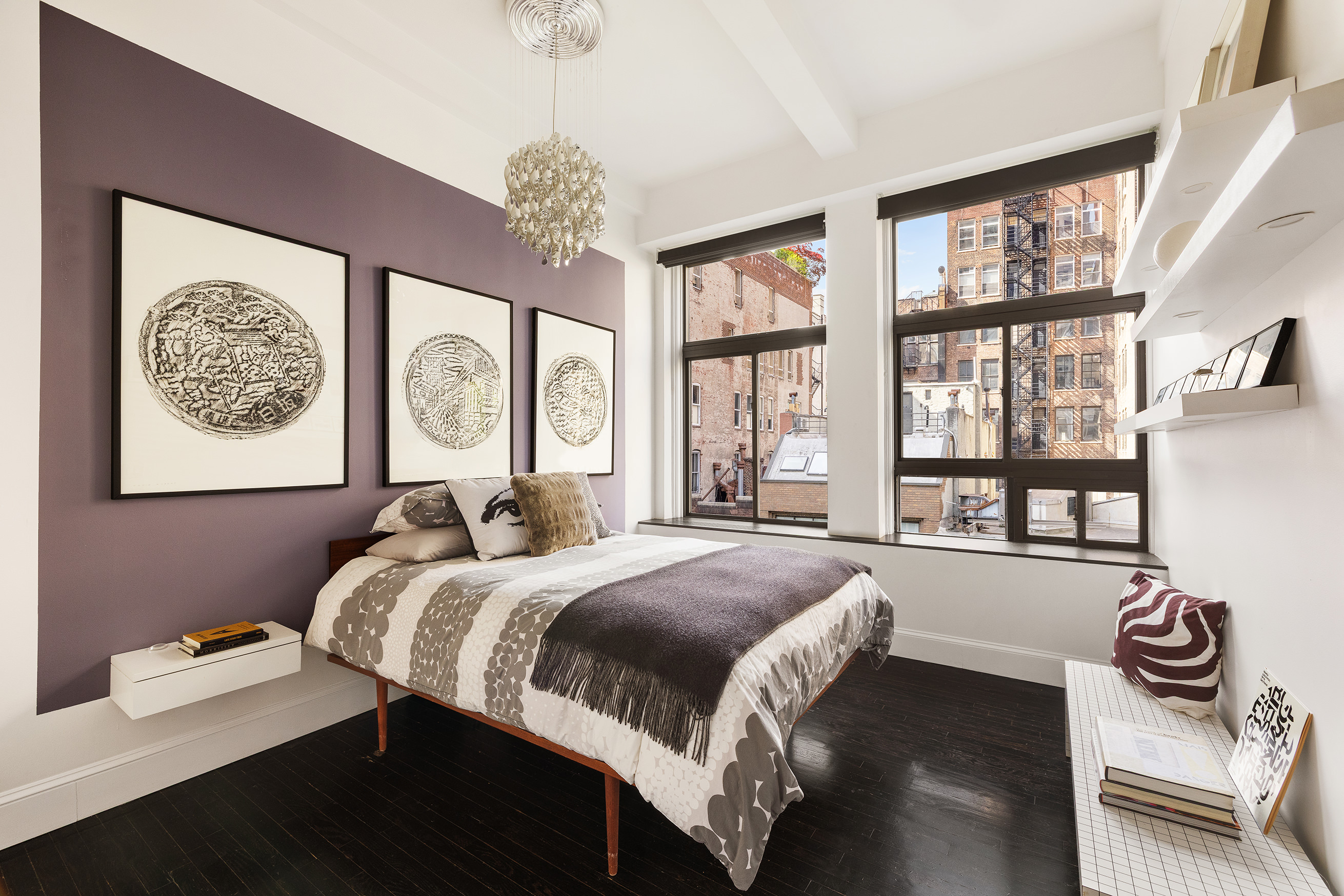 21 East 22nd Street, Unit 6H Manhattan, NY 10010 - Photo 8 of 13 a bedroom with a bed and a large window