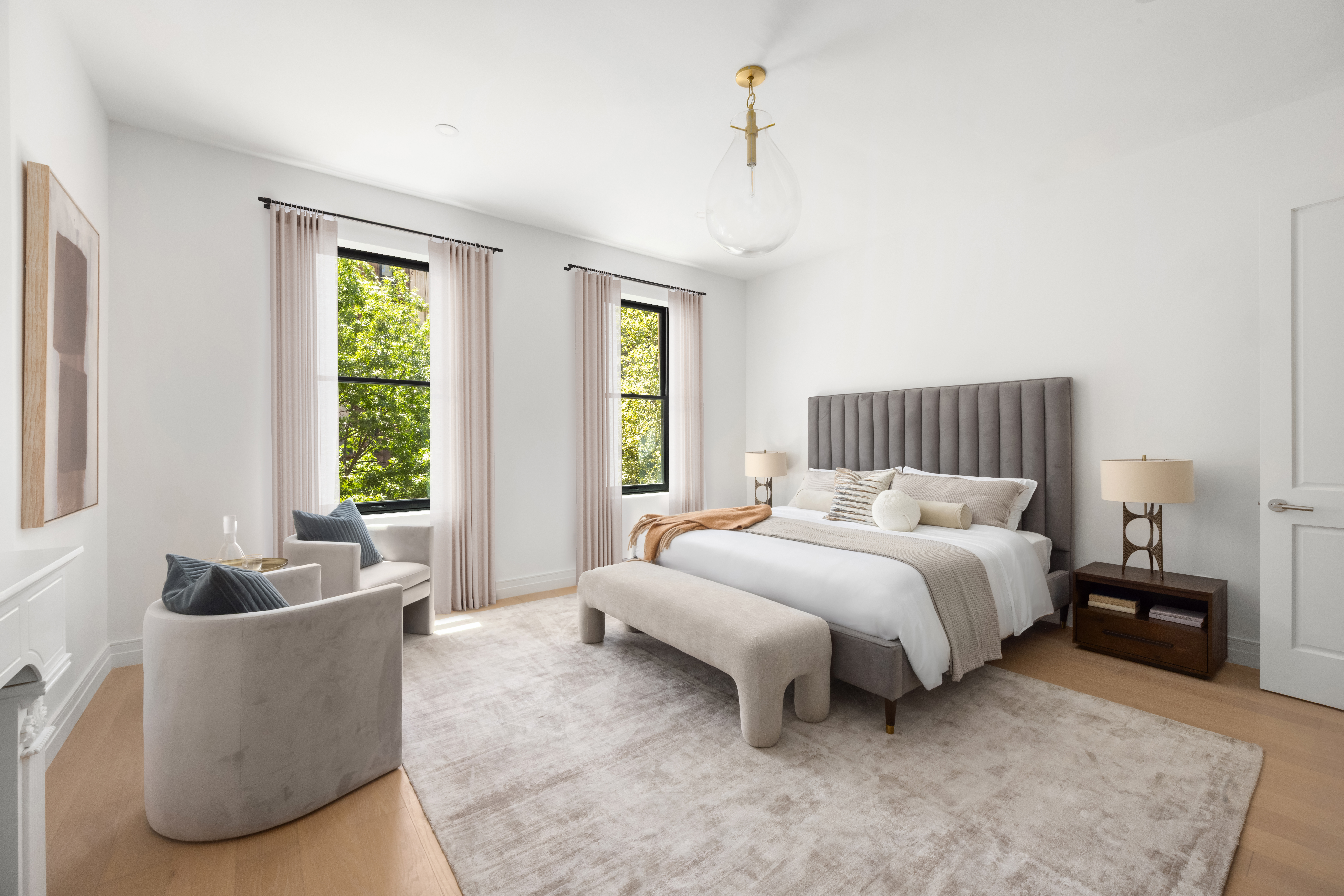 53 West 85th Street Manhattan, NY 10024 - Photo 16 of 37 a spacious bedroom with a bed and a couch