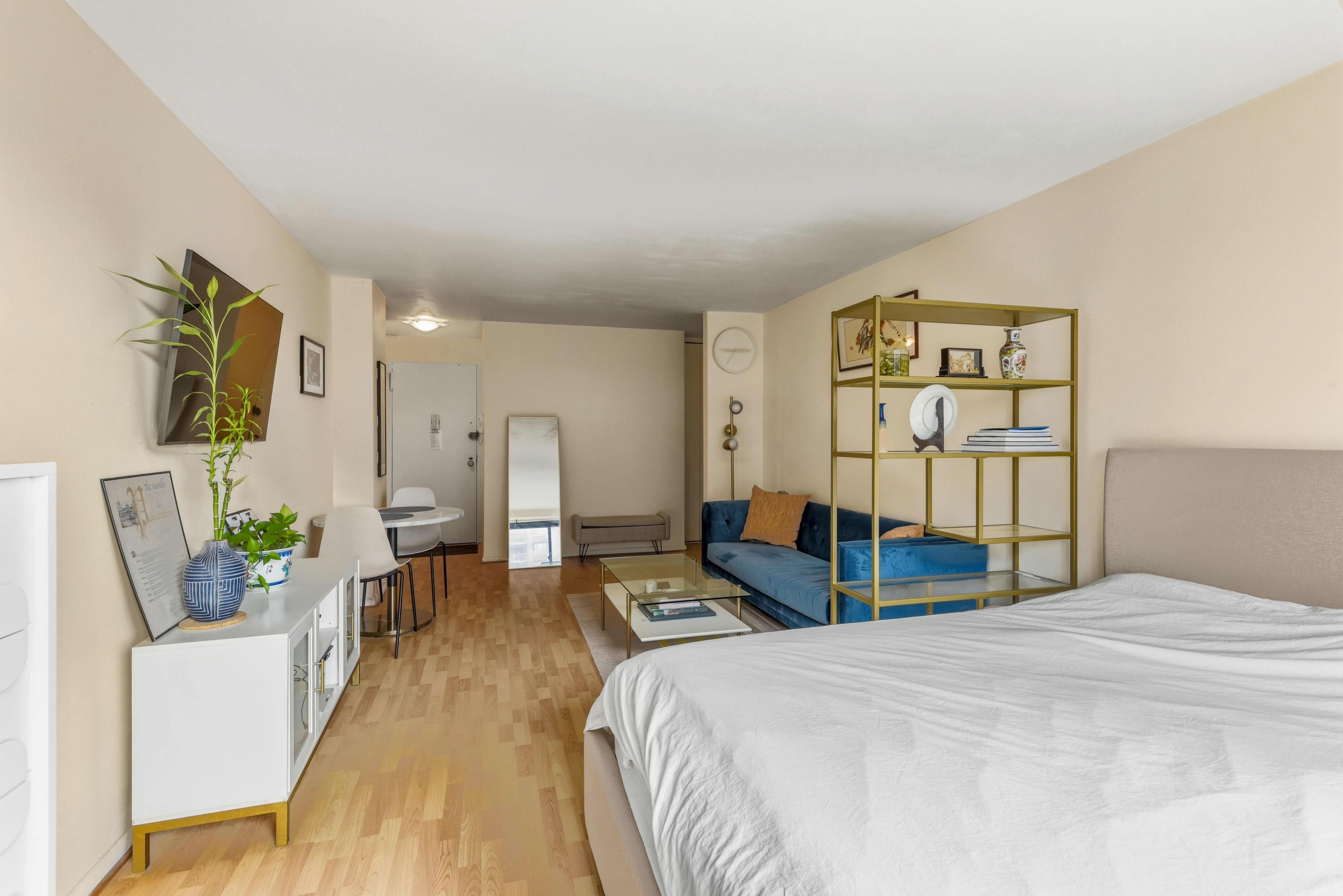 195 Willoughby Avenue, Unit 702 Brooklyn, NY 11205 - Photo 5 of 11 a bedroom with a bed window and couch