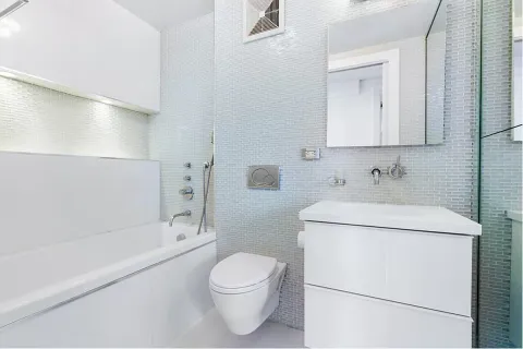 a bathroom with a sink toilet and vanity