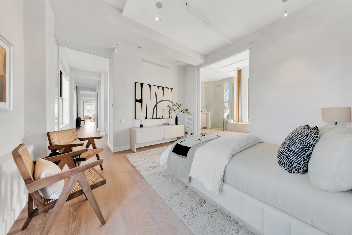 38 Crosby Street, Unit 8 Manhattan, NY 10013 - Photo 8 of 27 a bedroom with a bed and a chair