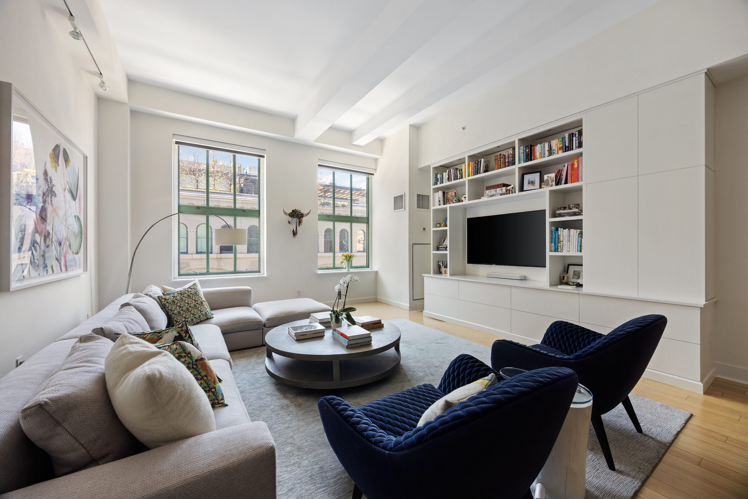 415 Greenwich Street, Unit 5D Manhattan, NY 10013 - Photo 1 of 16 a living room with furniture and a flat screen tv
