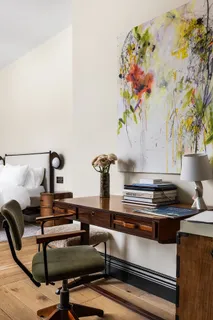 a table with a vase and flowers on it