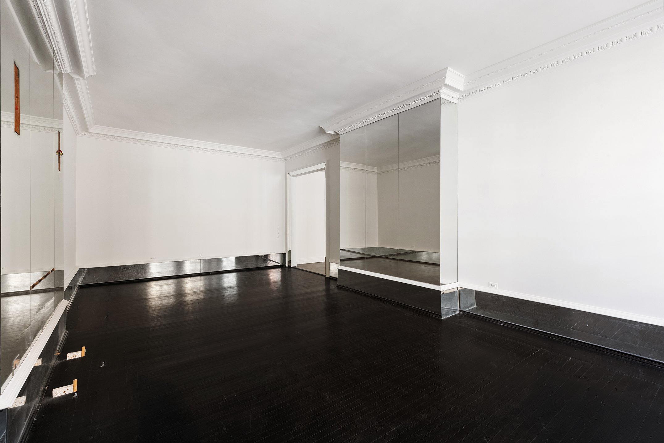 45 East 66th Street, Unit 4NW Manhattan, NY 10065 - Photo 13 of 29 a view of an empty room with glass door