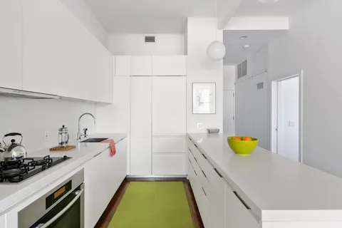 a kitchen with a sink and appliances