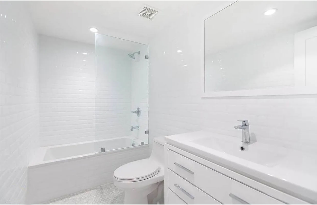 1128 Halsey Street, Unit 1 Brooklyn, NY 11207 - Photo 4 of 6 a bathroom with a sink a toilet and a bathtub