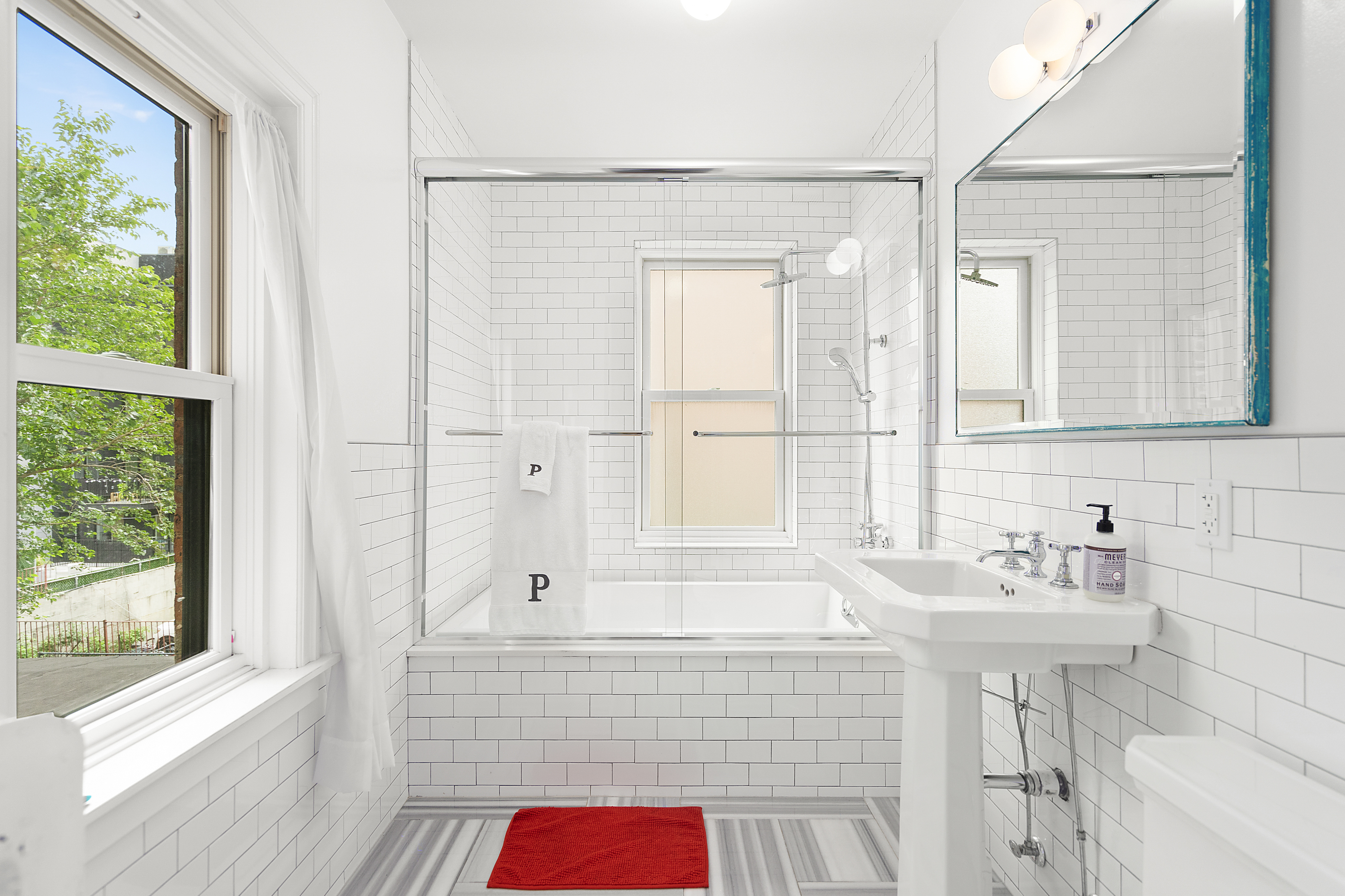 394 Lafayette Avenue, Unit 2 Brooklyn, NY 11238 - Photo 7 of 13 a bathroom with a sink and a bathtub