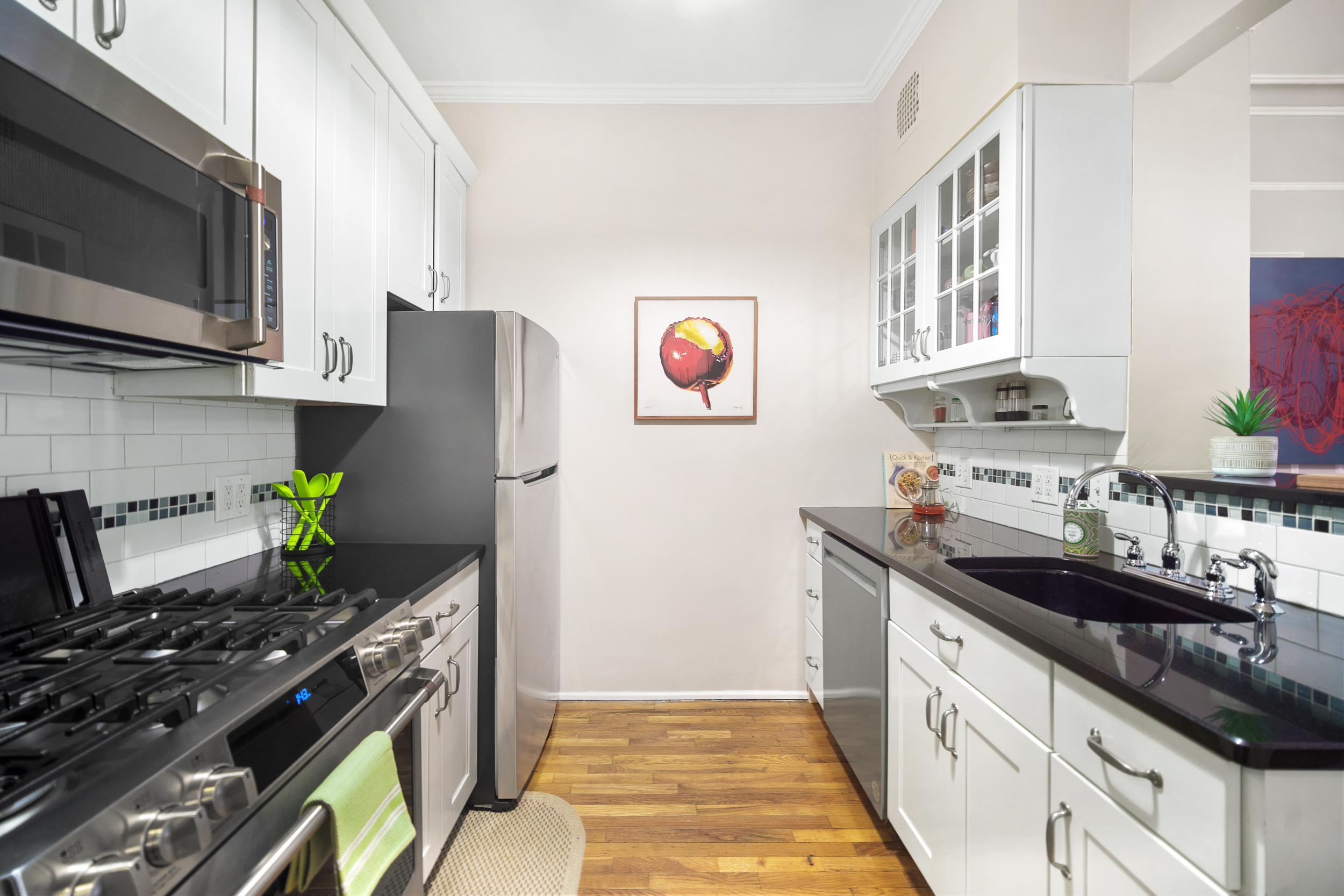 182 Saint Marks Avenue, Unit 2 Brooklyn, NY 11238 - Photo 5 of 14 a kitchen with stainless steel appliances a stove a sink and a refrigerator