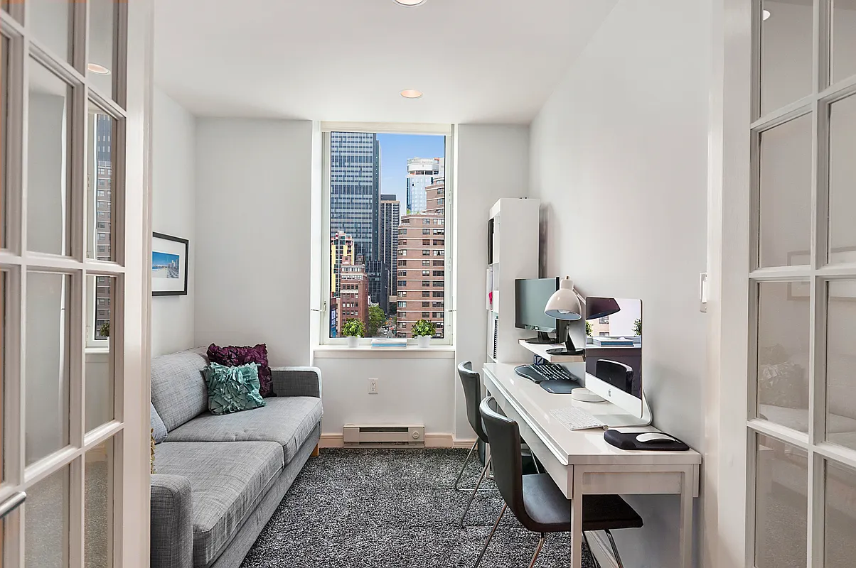 225 East 34th Street, Unit 8B Manhattan, NY 10016 - Photo 7 of 18 a living room with furniture and a window