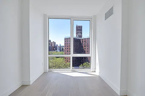 a view of a room that has a window in it