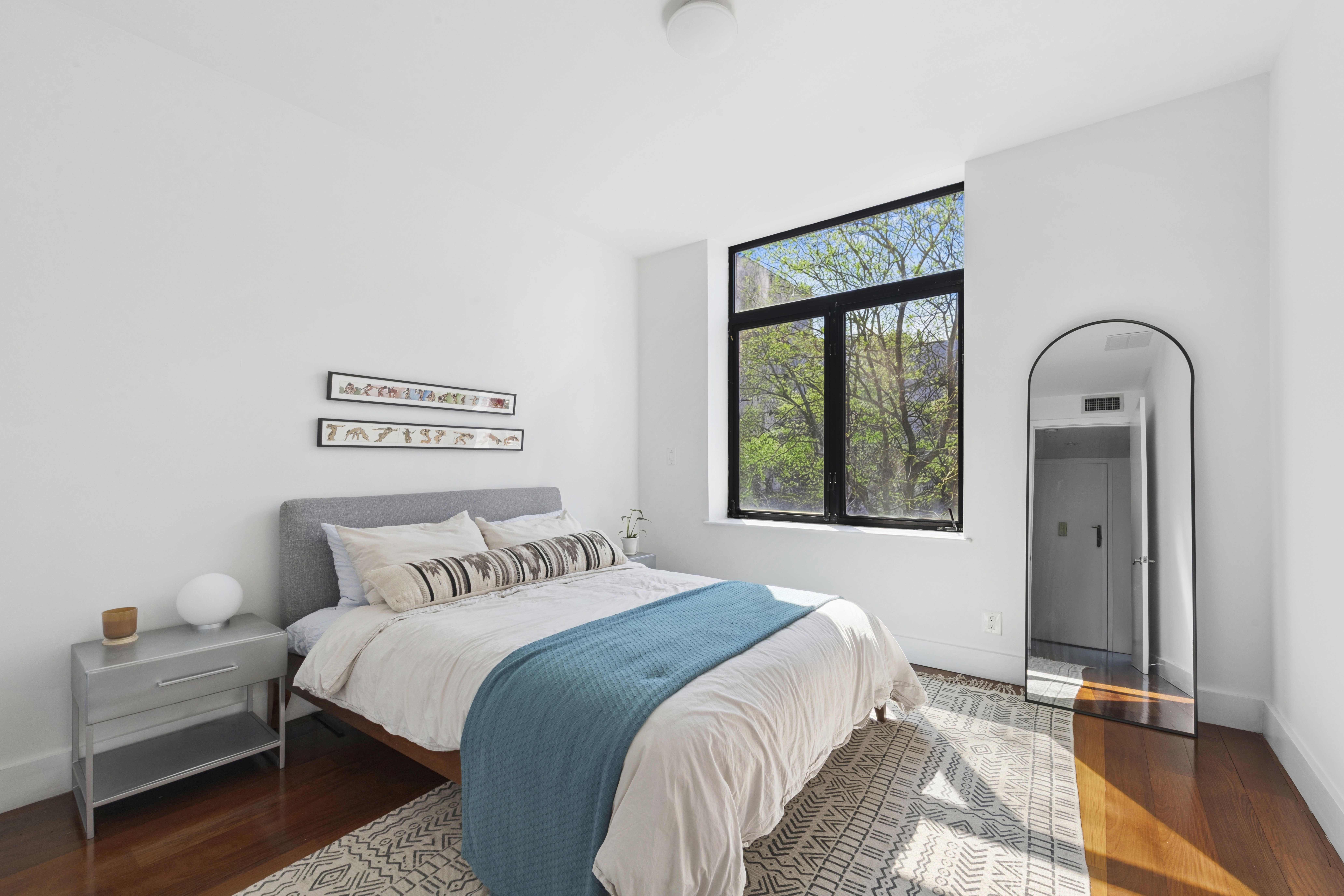 82 Adelphi Street, Unit 3D Brooklyn, NY 11205 - Photo 4 of 7 a bedroom with a bed and a window