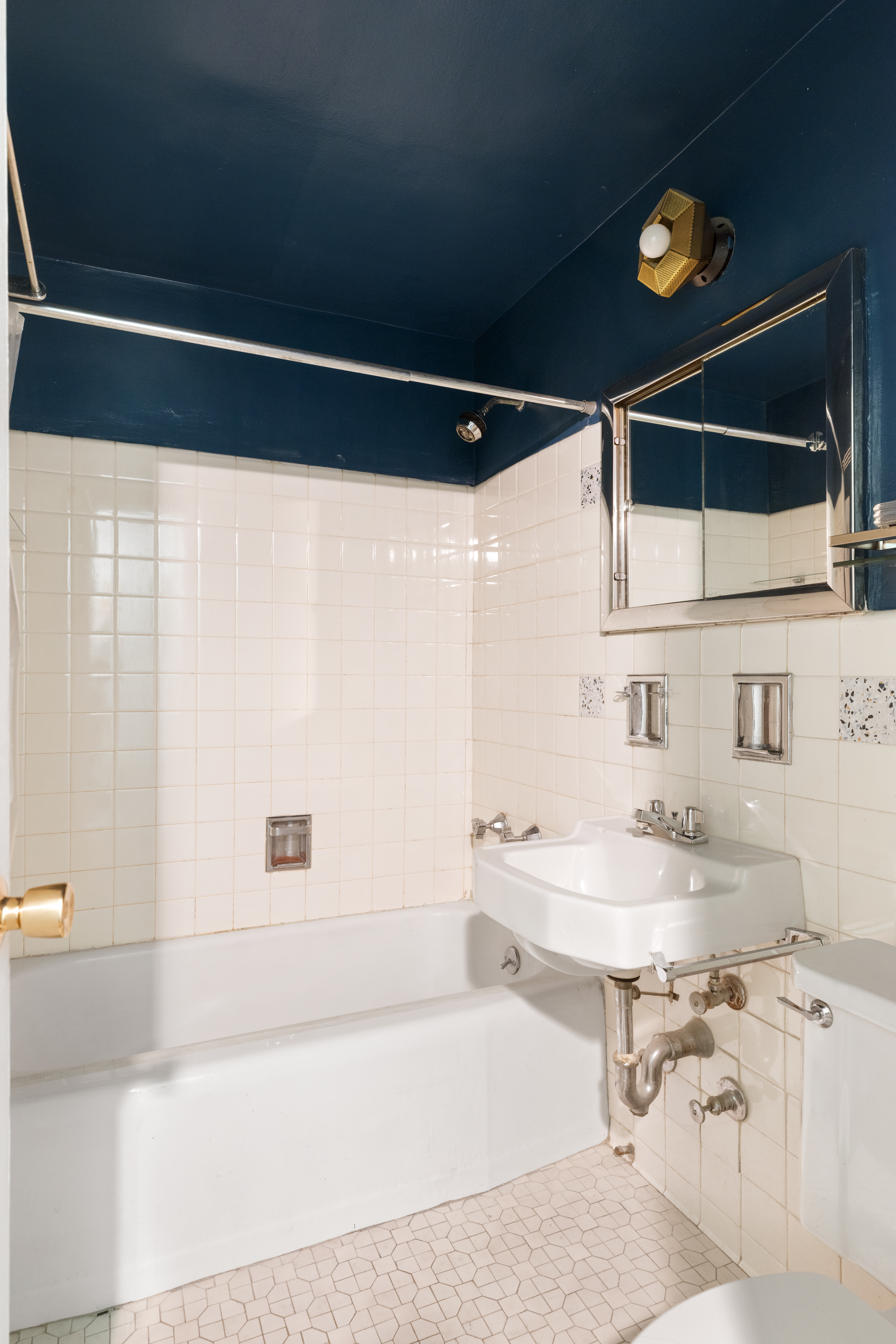 10 East End Avenue, Unit 18E Manhattan, NY 10075 - Photo 7 of 13 a bathroom with a sink and a bathtub