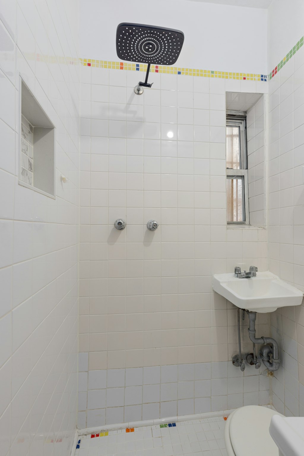 427 East 6th Street, Unit 1R Manhattan, NY 10009 - Photo 5 of 8 a bathroom with a sink a toilet and mirror