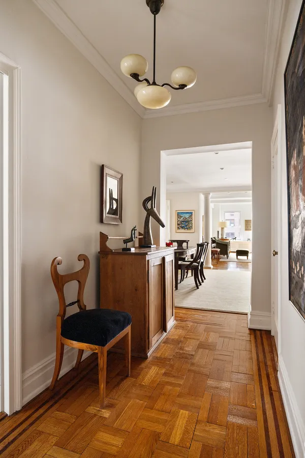 a view of a room with furniture and a chandelier