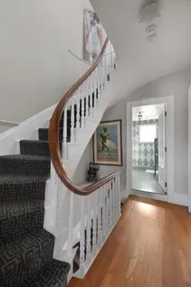 a view of entryway with wooden floor