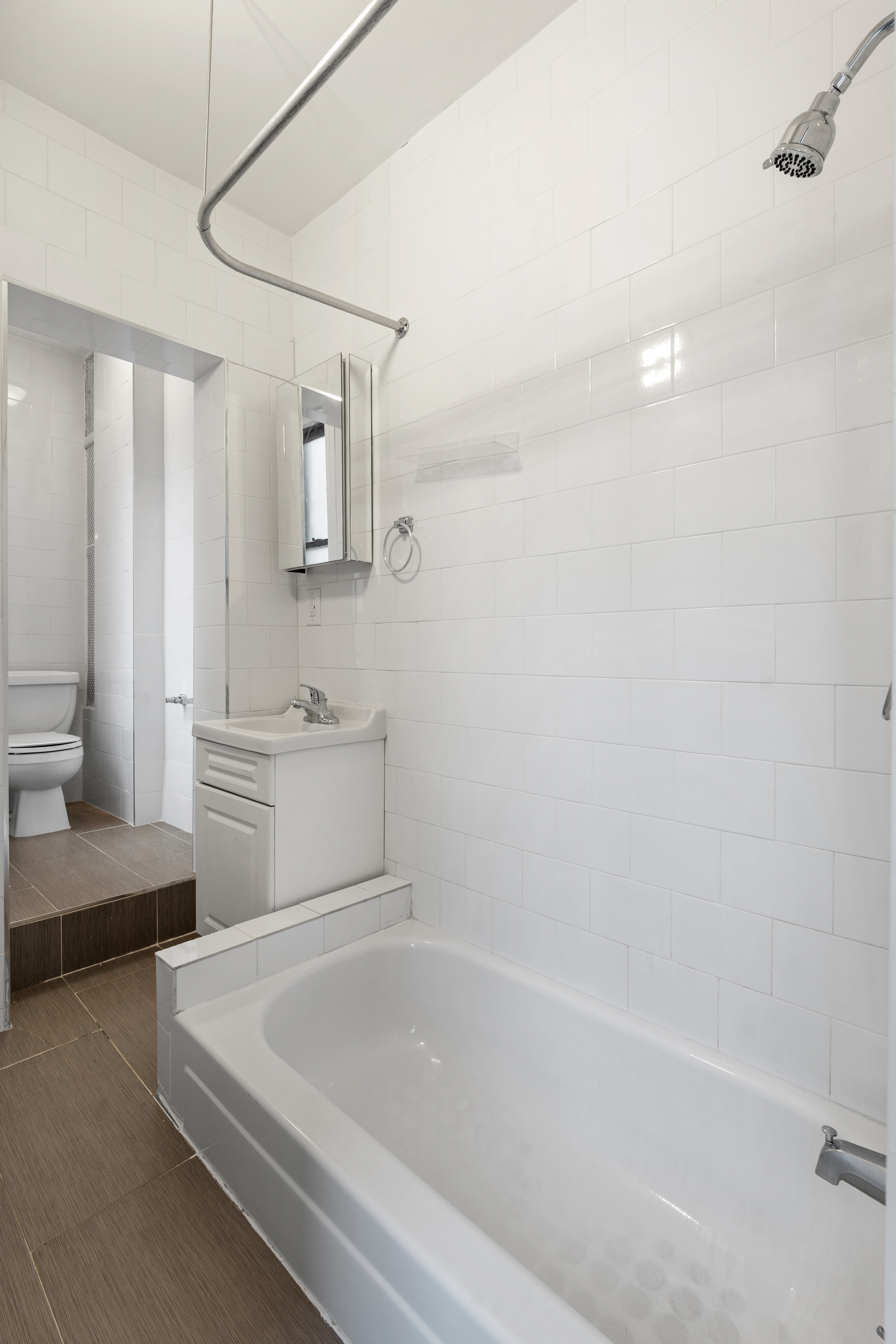 826 9th Avenue, Unit 5RS Manhattan, NY 10019 - Photo 12 of 15 a bathroom with a tub a sink and a shower