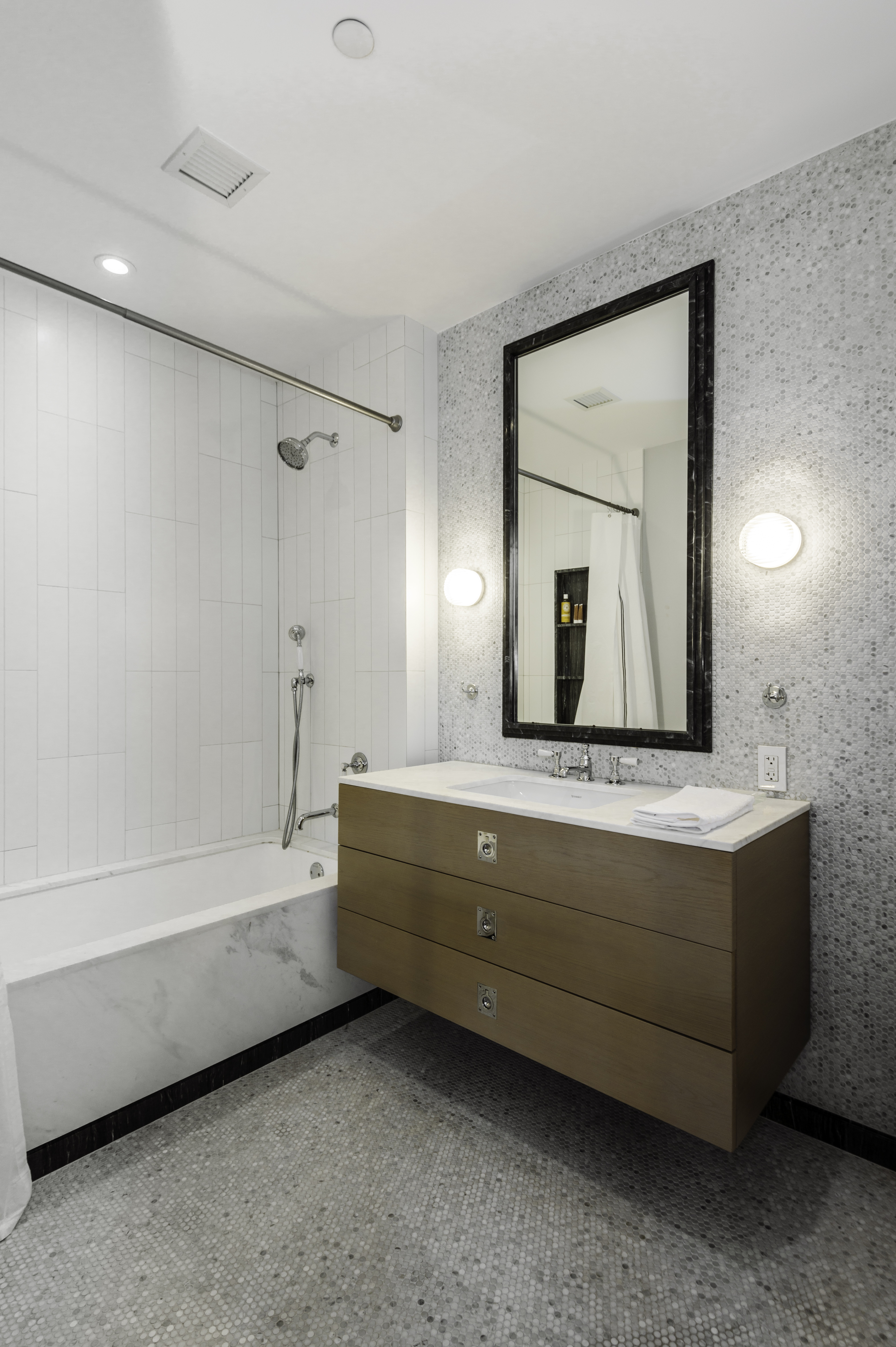 438 East 12th Street, Unit 6J Manhattan, NY 10009 - Photo 6 of 14 a bathroom with a granite countertop sink mirror and bathtub