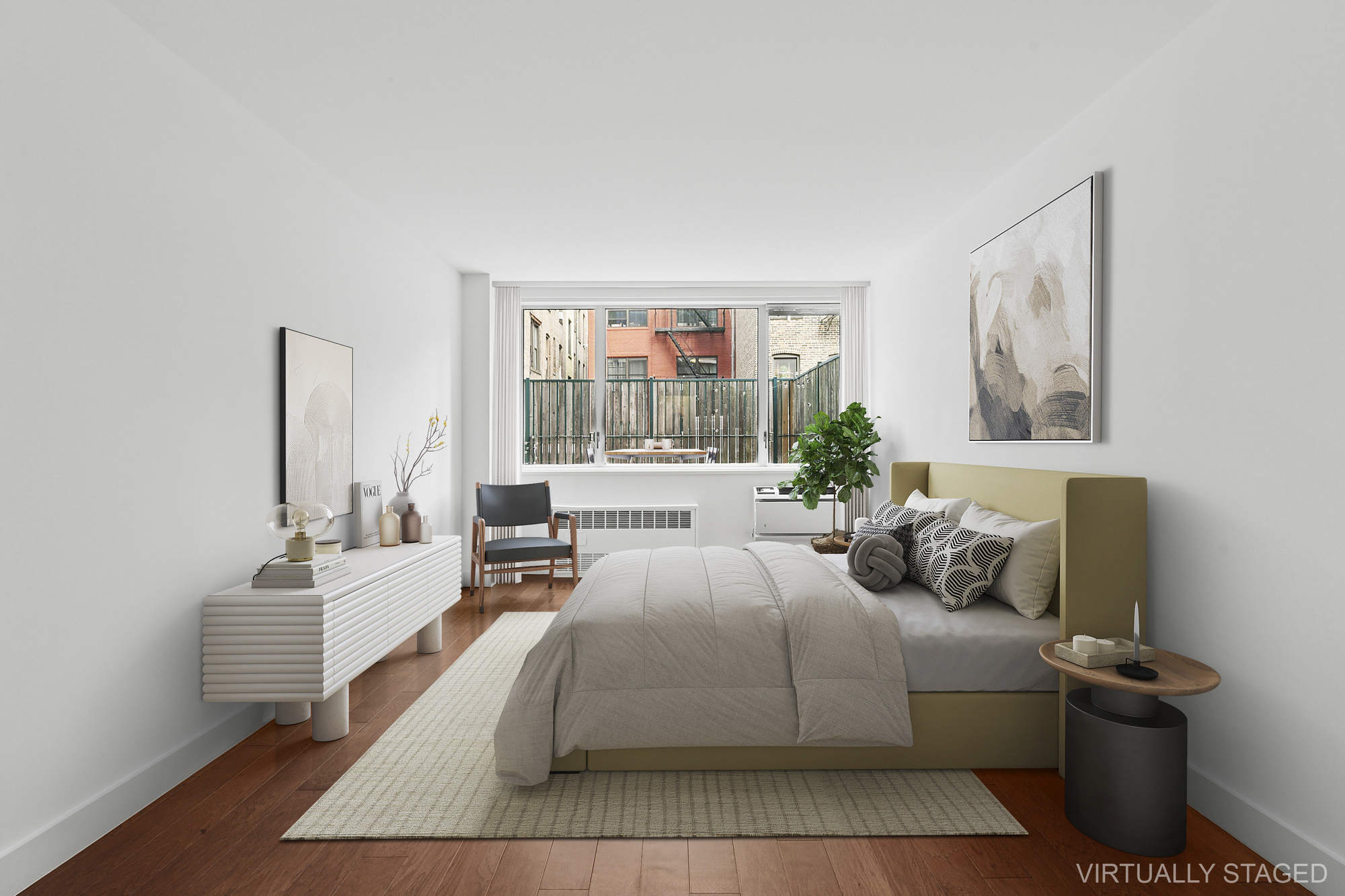 333 East 14th Street, Unit 2C Manhattan, NY 10003 - Photo 6 of 12 a bedroom with a bed and wooden floor