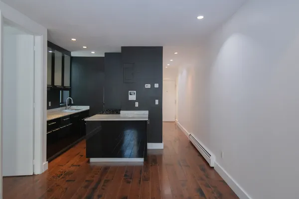 a kitchen with a sink and a refrigerator
