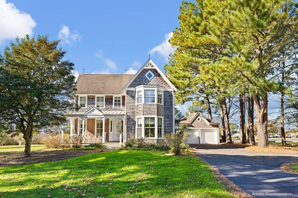 front view of a house with a yard