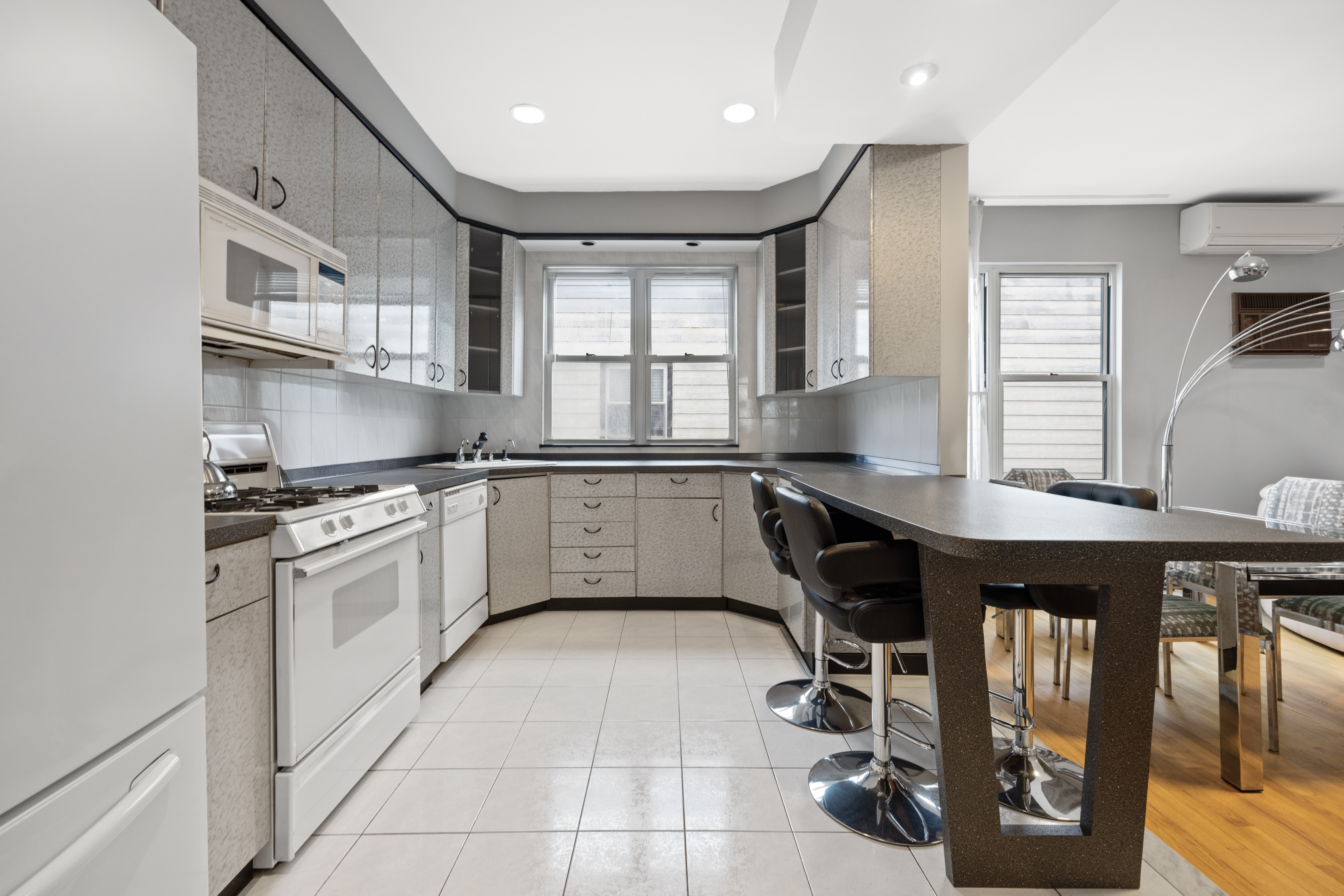1635 West 12th Street Brooklyn, NY 11223 - Photo 5 of 21 a kitchen with a sink appliances and cabinets