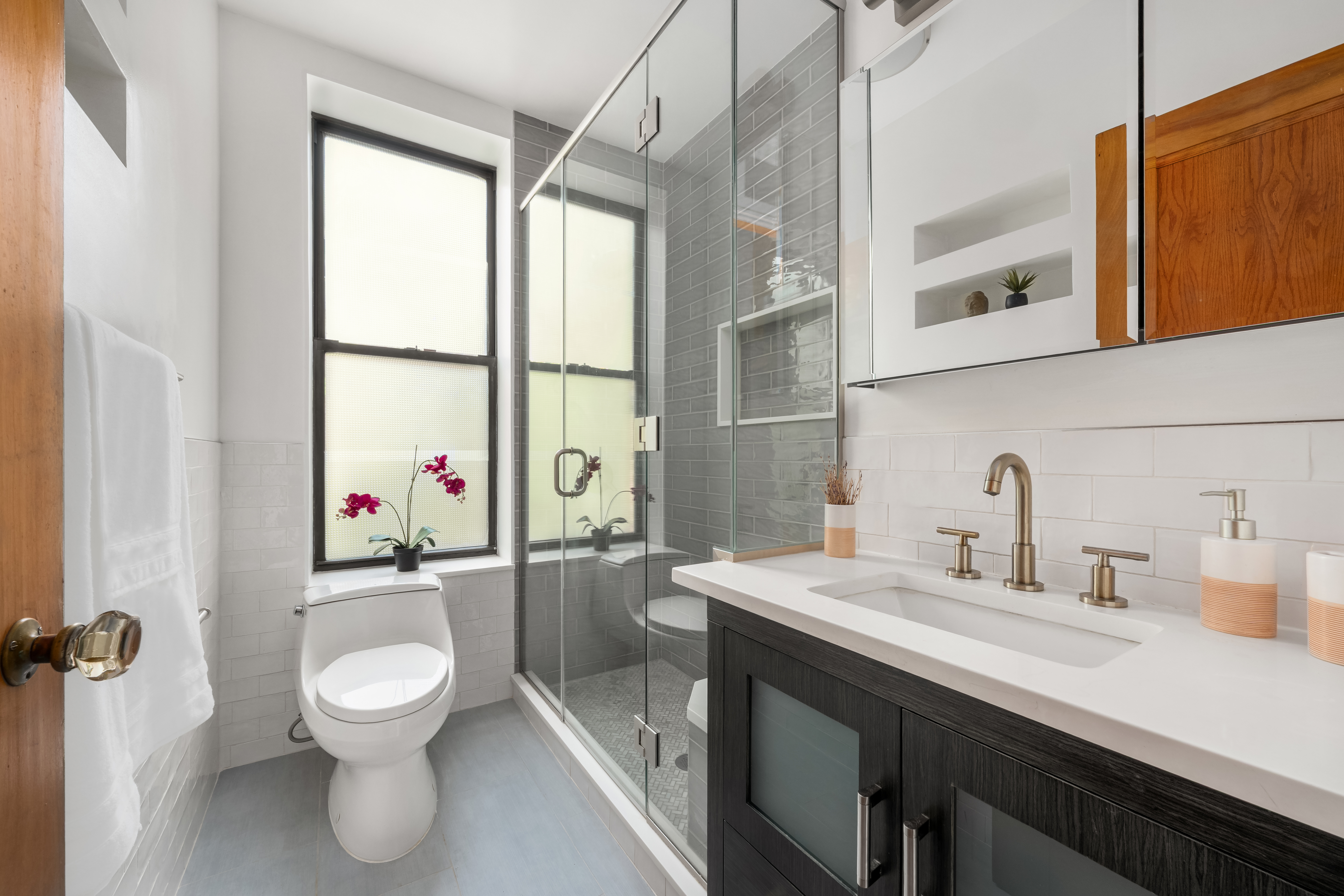 35 West 82nd Street, Unit 4C Manhattan, NY 10024 - Photo 8 of 11 a bathroom with a sink a toilet and a mirror