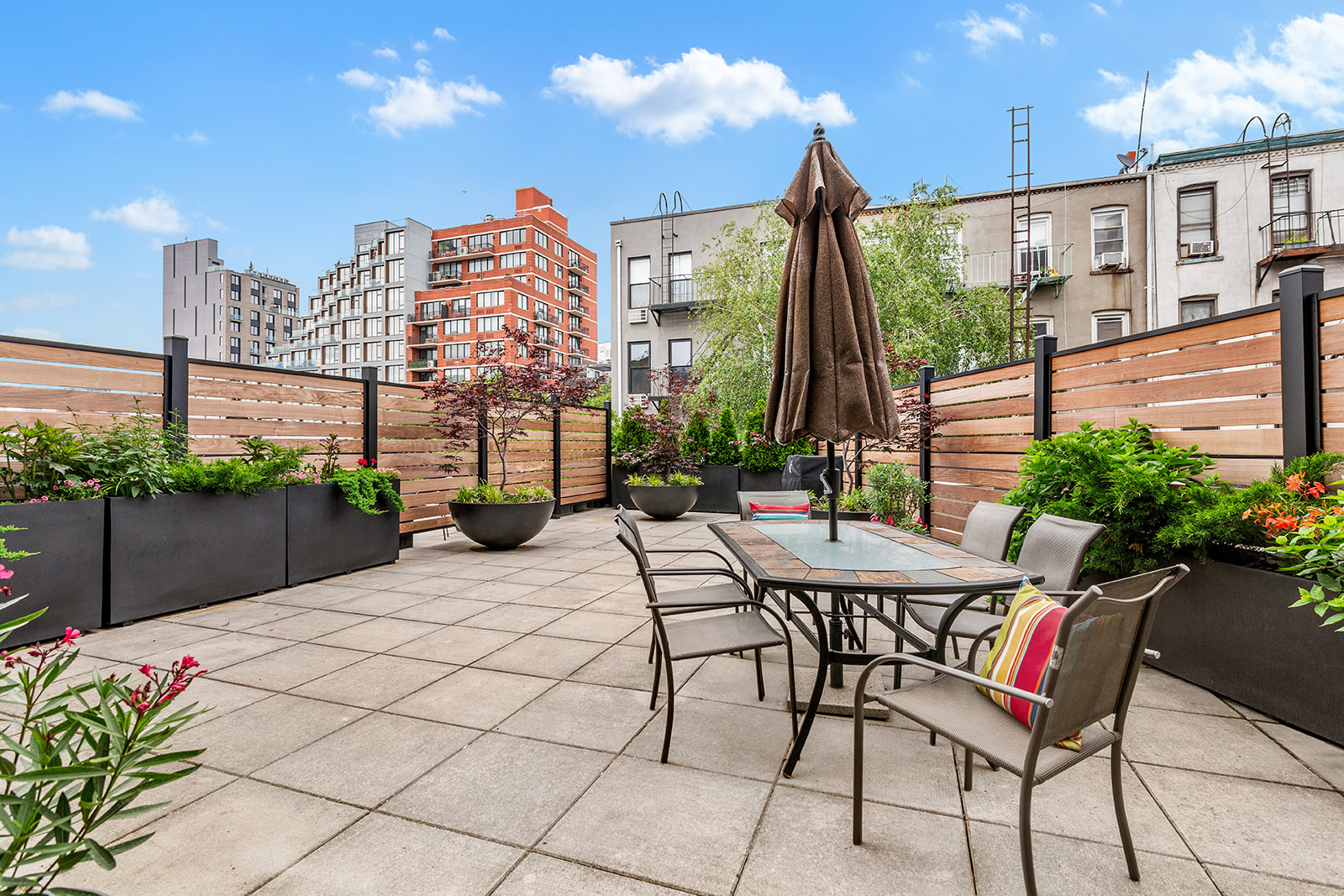 309 2nd Street, Unit 2F Brooklyn, NY 11215 - Photo 2 of 10 a view of a patio with table and chairs potted plants