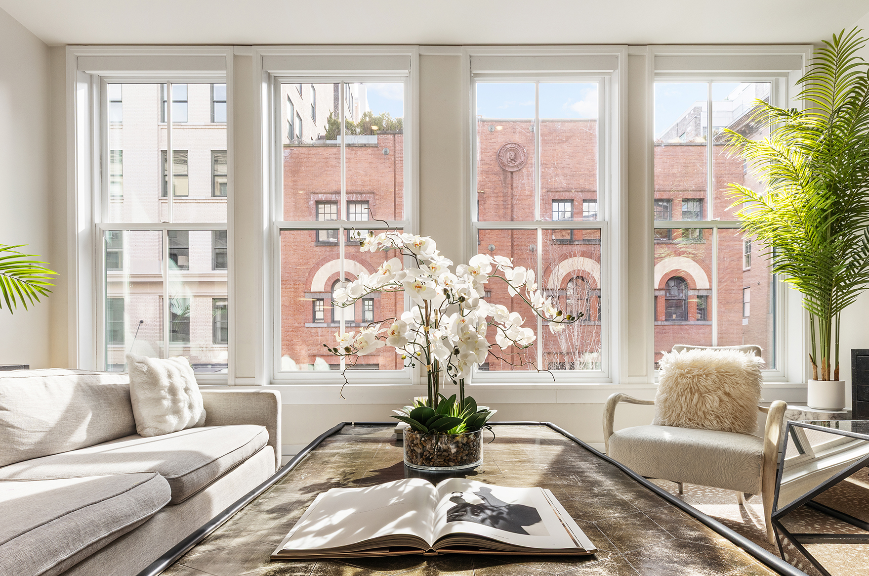 52 Laight Street, Unit R2 Manhattan, NY 10013 - Photo 3 of 21 a living room with furniture and a large window