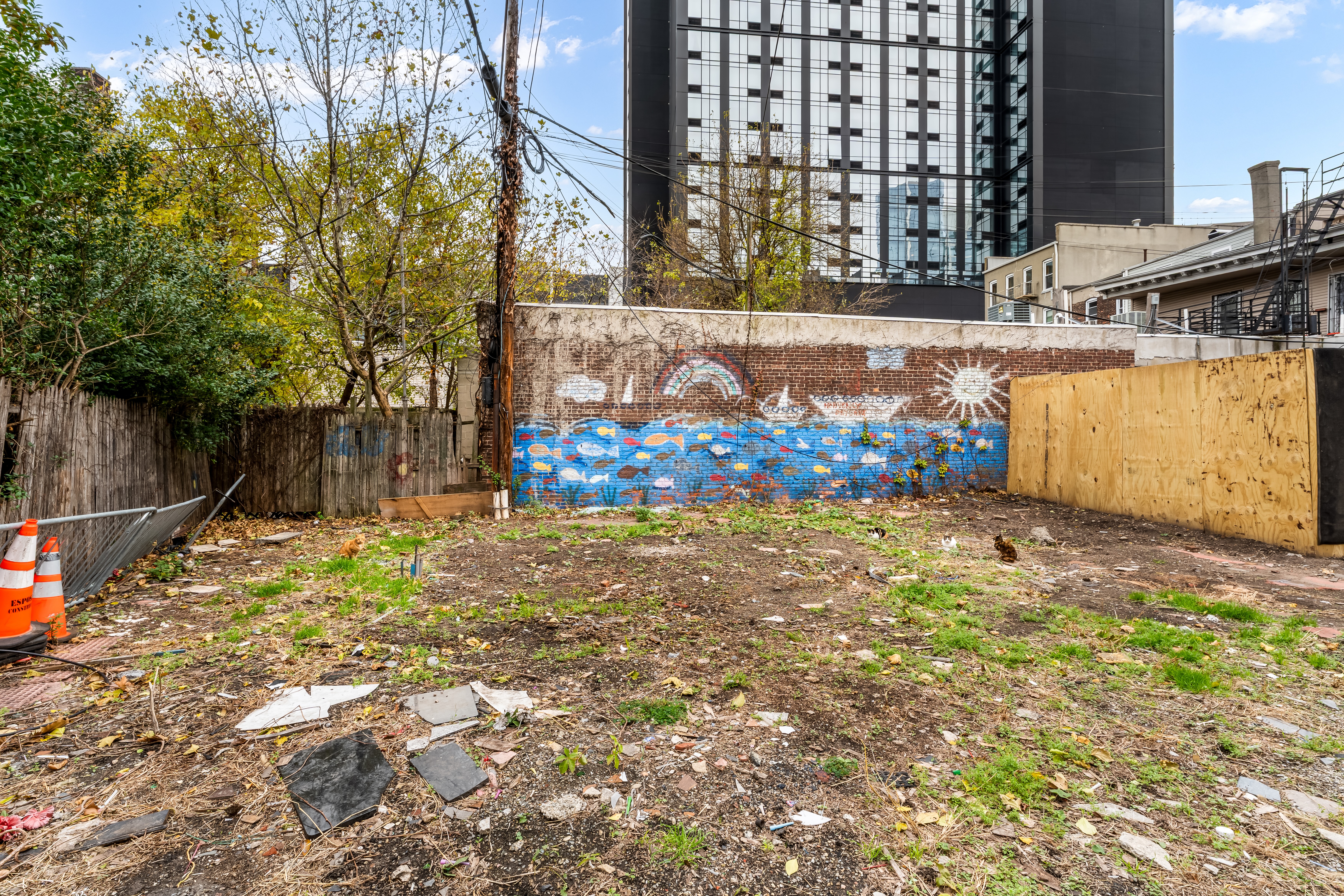 646 Newark Avenue, Unit COMMERCIAL Jersey City, NJ 07306 - Photo 28 of 35 a view of a backyard with wooden fence