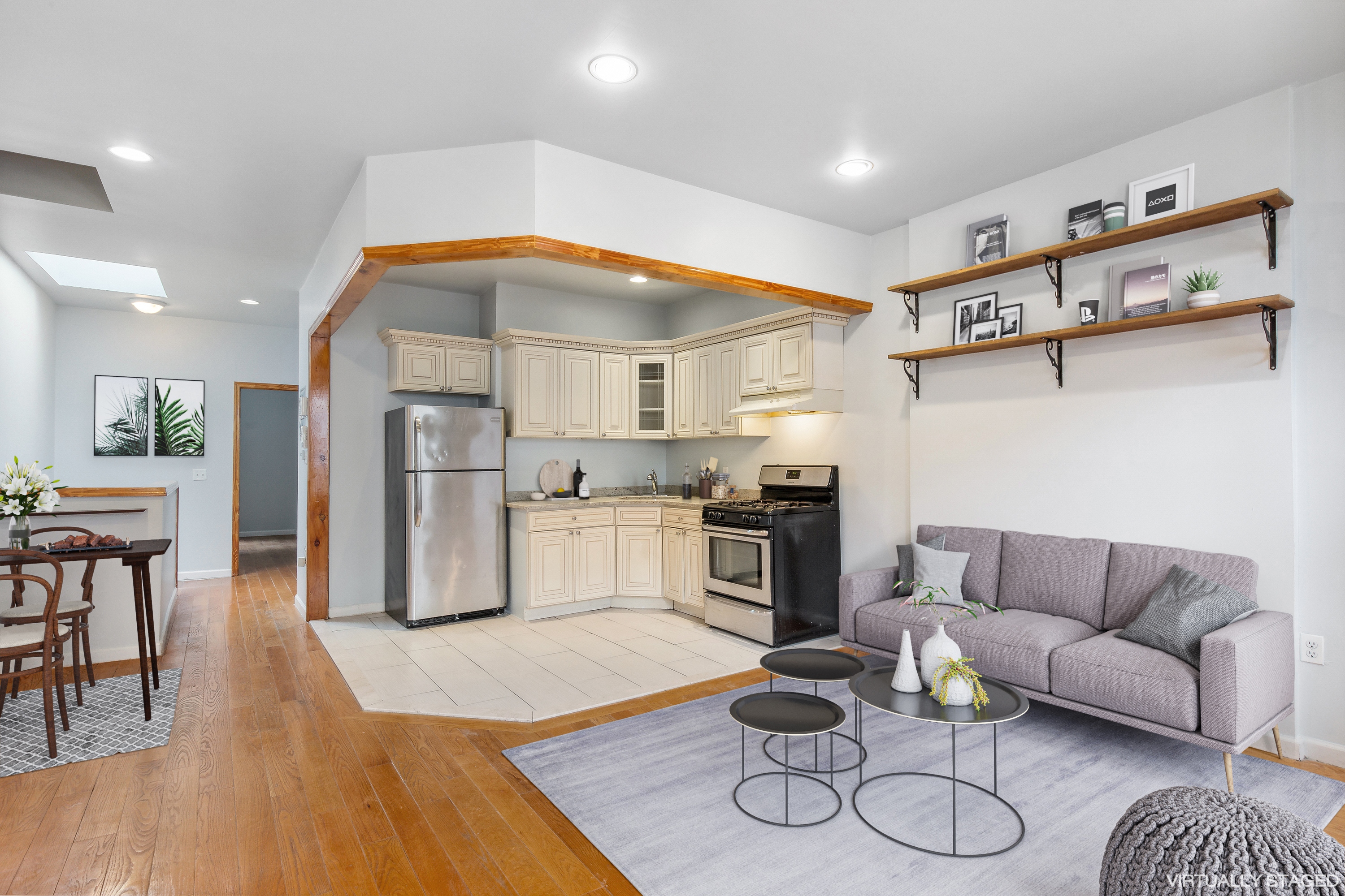 530 West 175th Street, Unit 2 Manhattan, NY 10033 - Photo 4 of 12 a living room with furniture and kitchen view