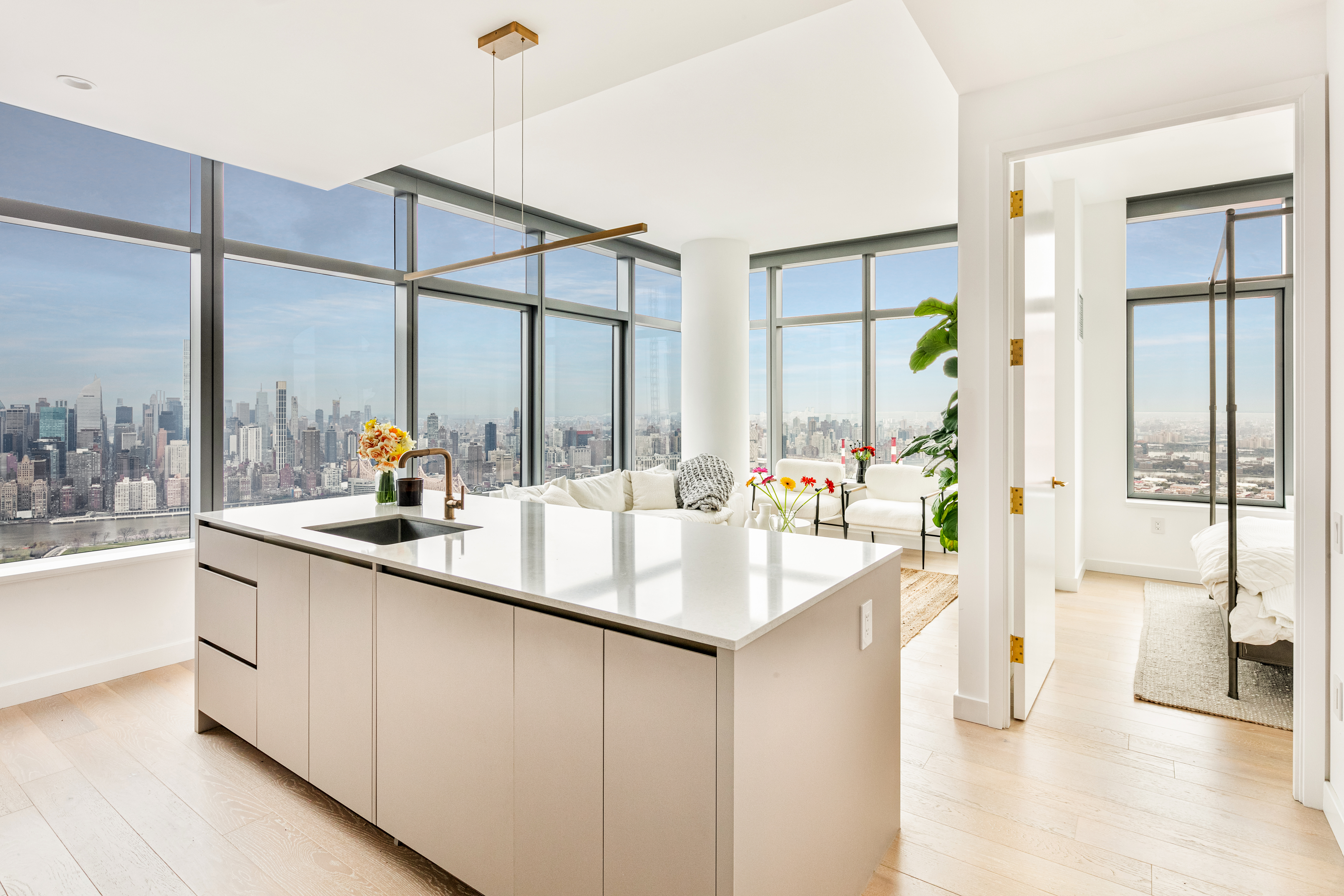 45-3 Ct Square West, Unit PH202 Queens, NY 11101 - Photo 1 of 12 a kitchen with counter top space and a sink