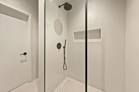 a view of a living room and bathroom