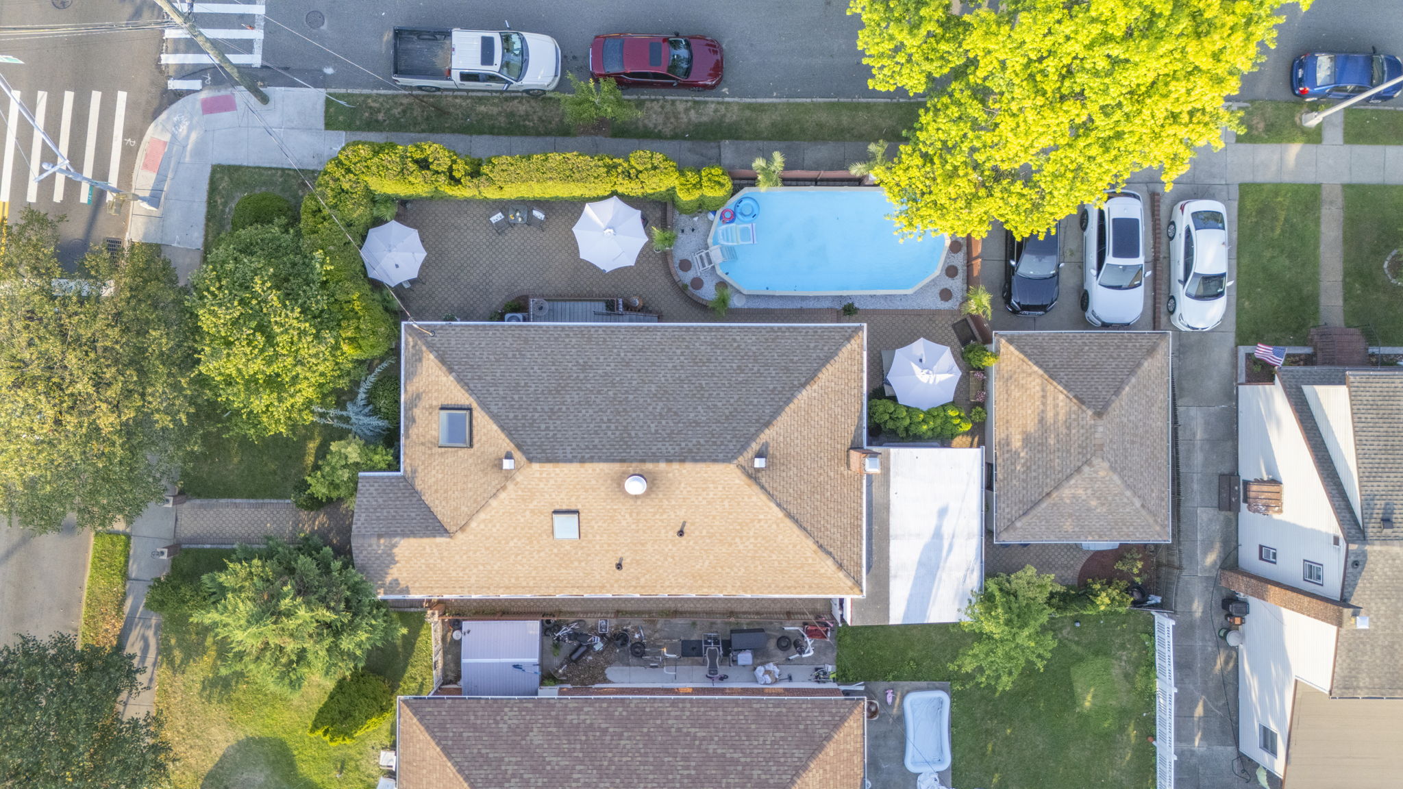 141-18 14th Avenue Queens, NY 11357 - Photo 22 of 26 an aerial view of a house with swimming pool and a yard